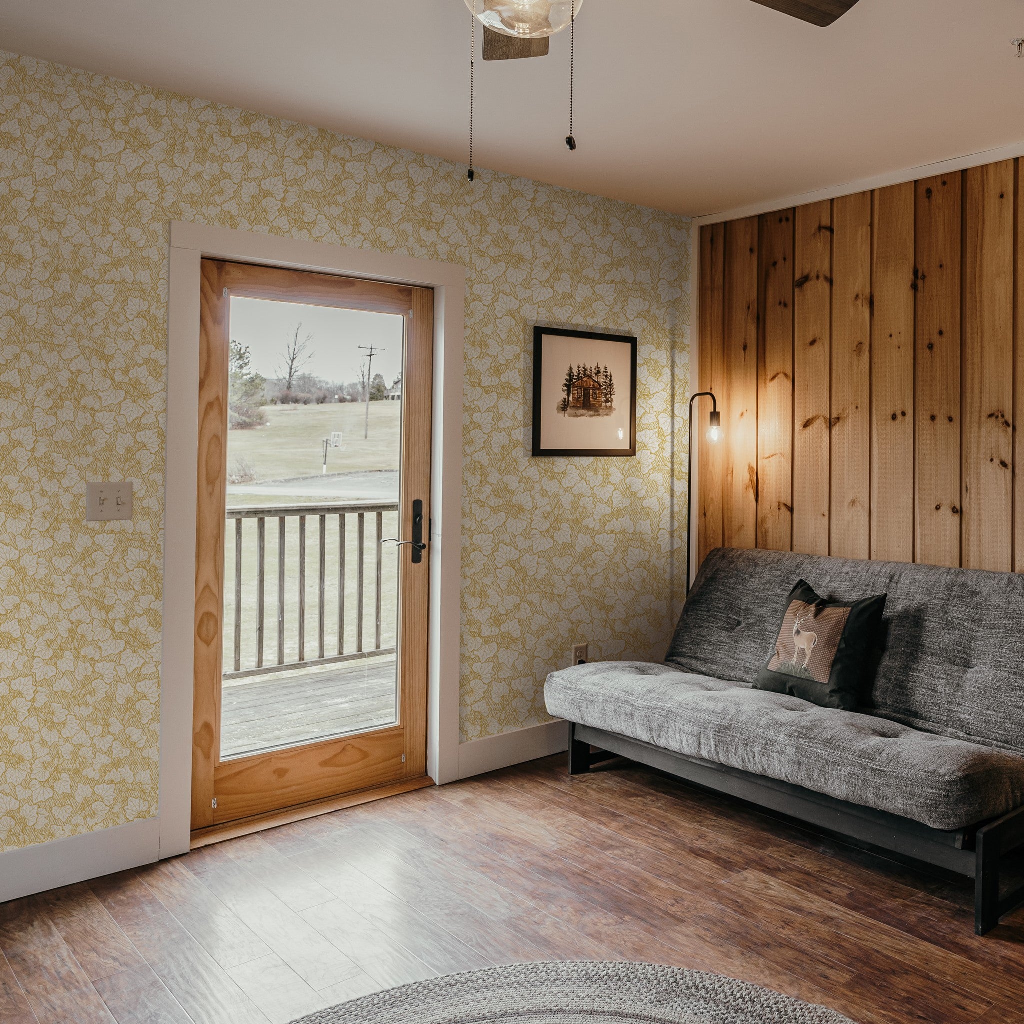 "Wall Blush's Heath Wallpaper featured in a cozy living room, enhancing the space with its elegant pattern."