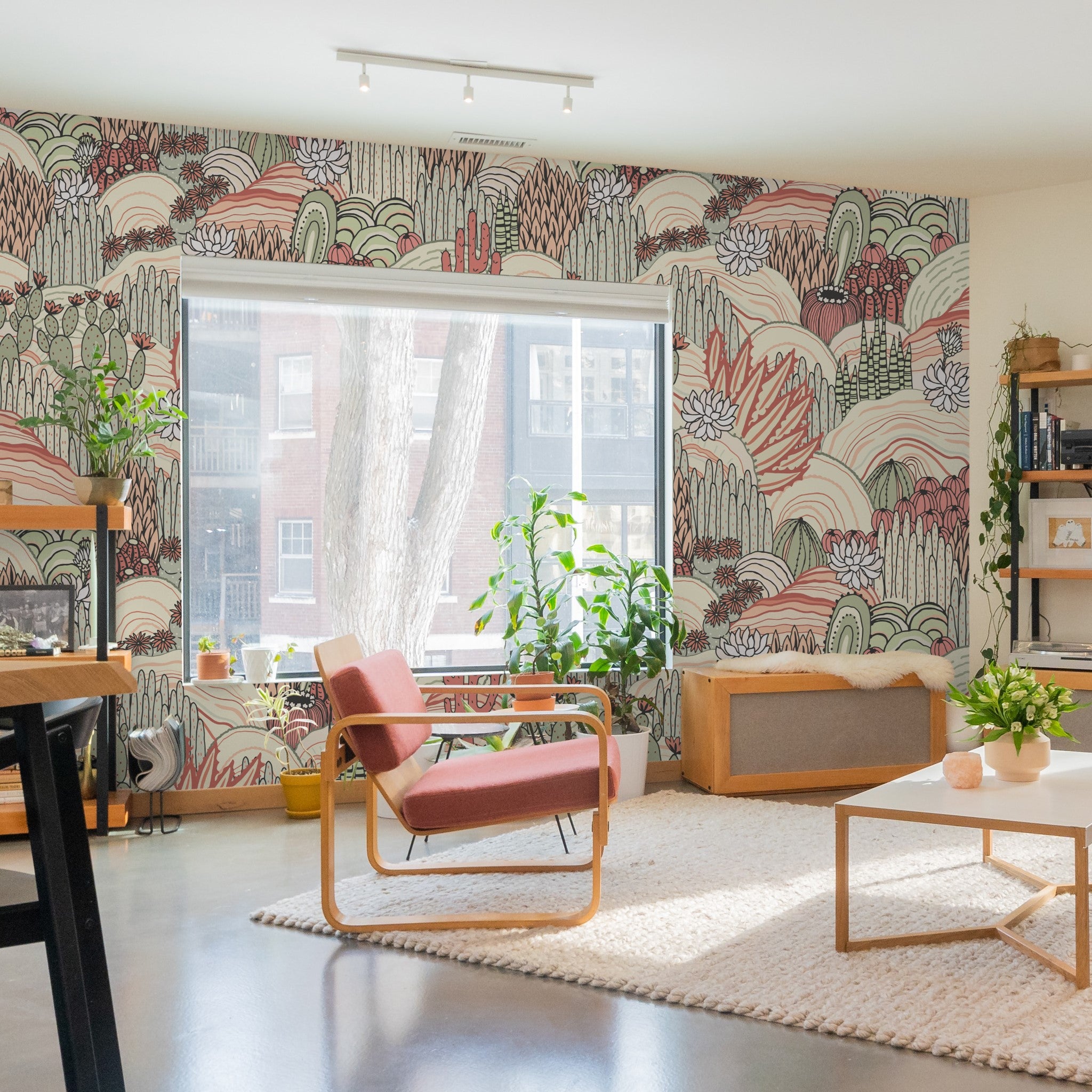 "Sage and Tango Wallpaper by Wall Blush, vibrant focal point in stylish living room decor."