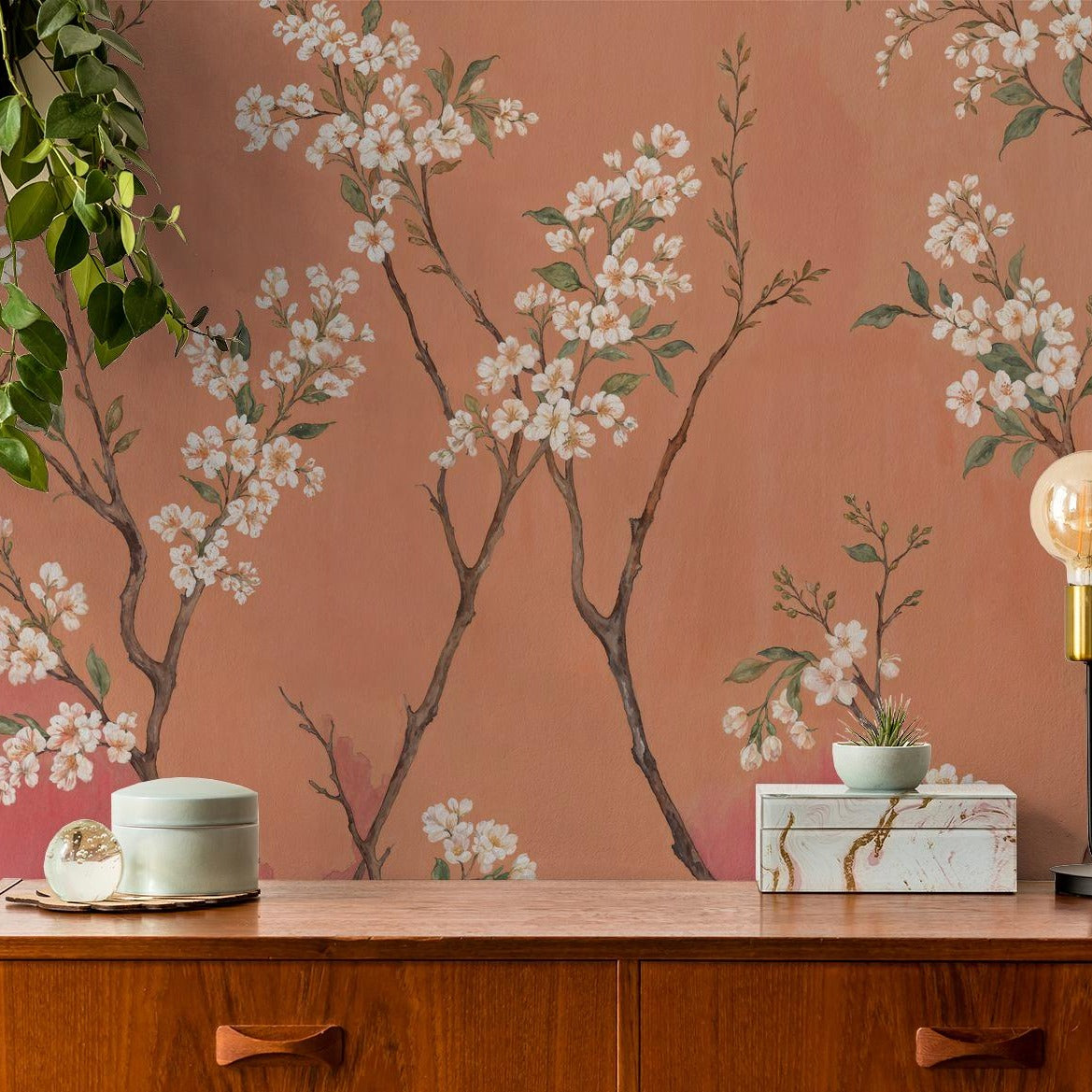 "Ombre Bloom Wallpaper by Wall Blush enhancing a cozy home office with warm tones and floral design."
