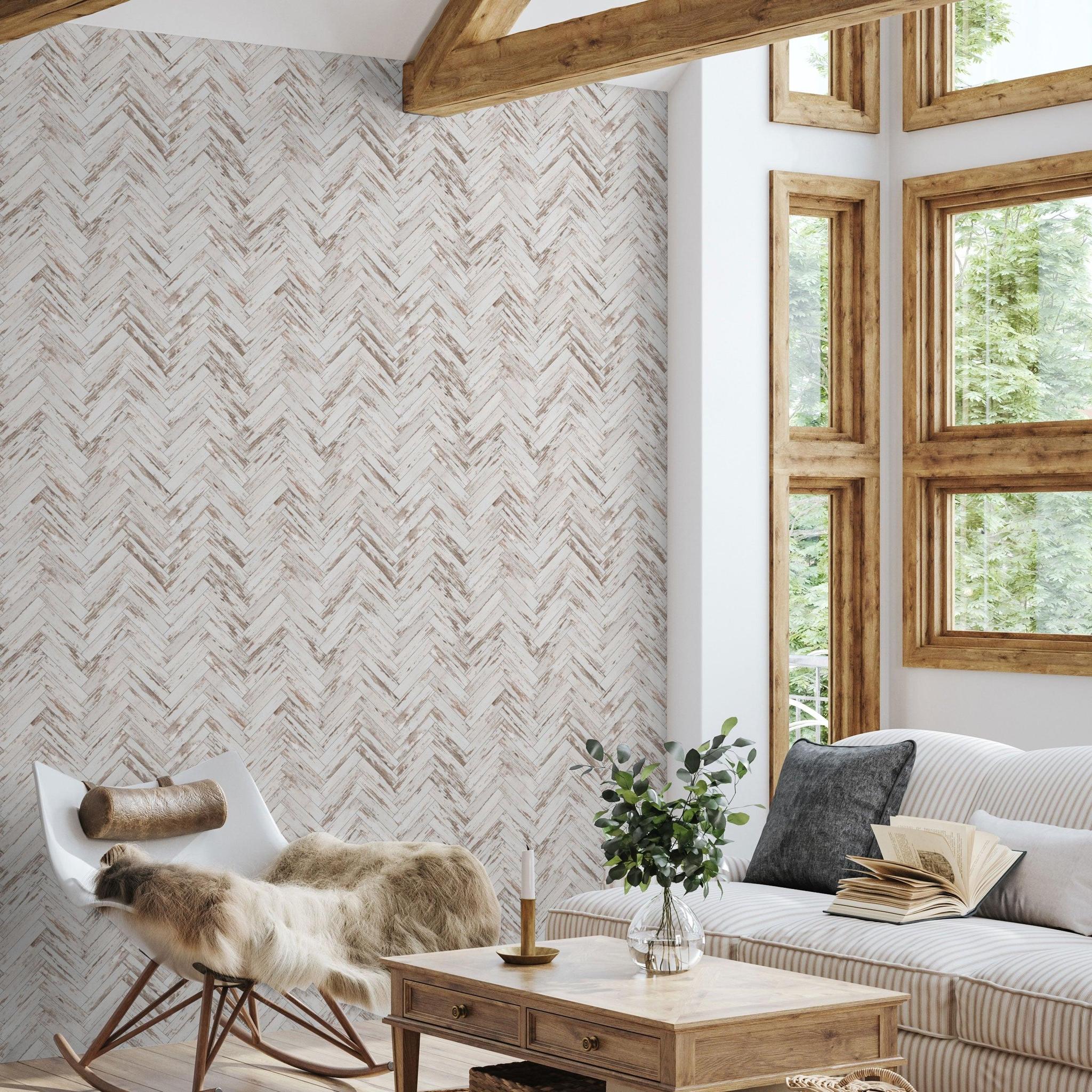 Alt: CUT Above The Rest Wallpaper from The Tamra Judge Line in a cozy living room with herringbone-patterned focus wall.