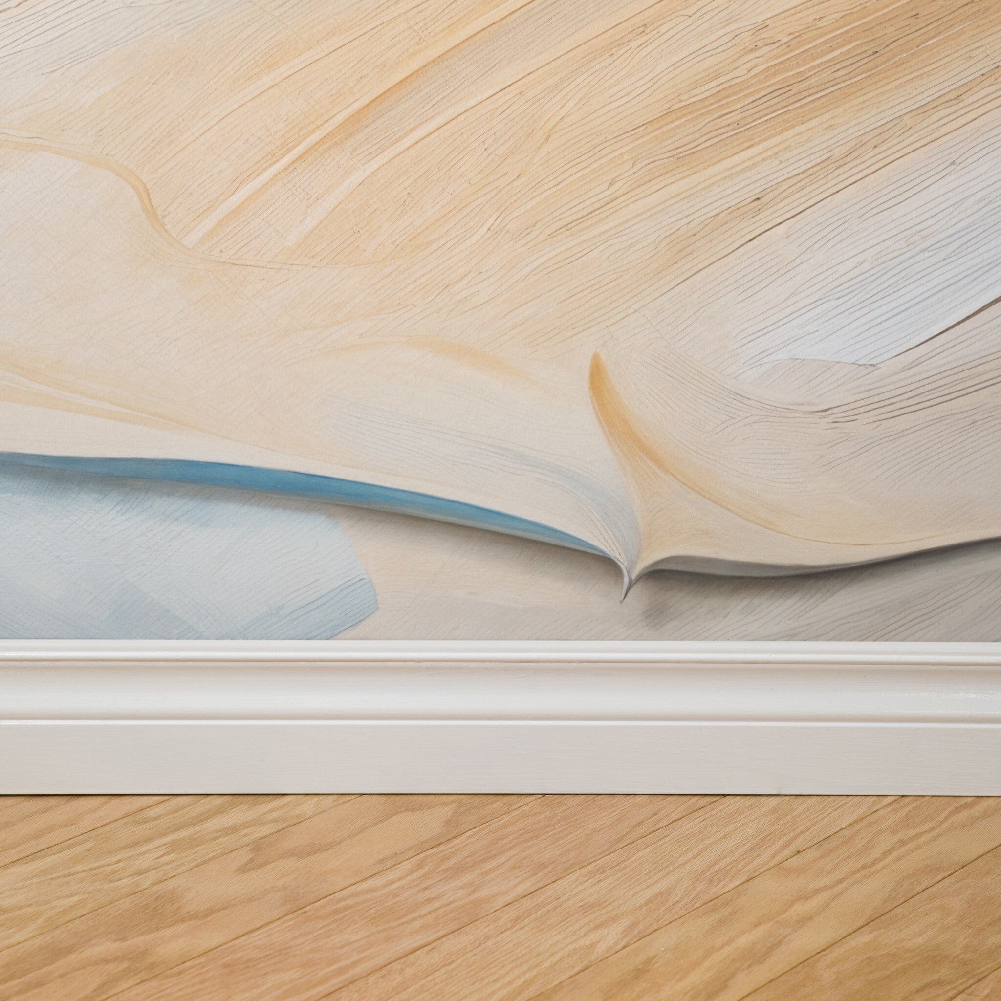 "Wall Blush's Coastal Drift Wallpaper installation in focus, showcasing a textured design in a modern home setting."