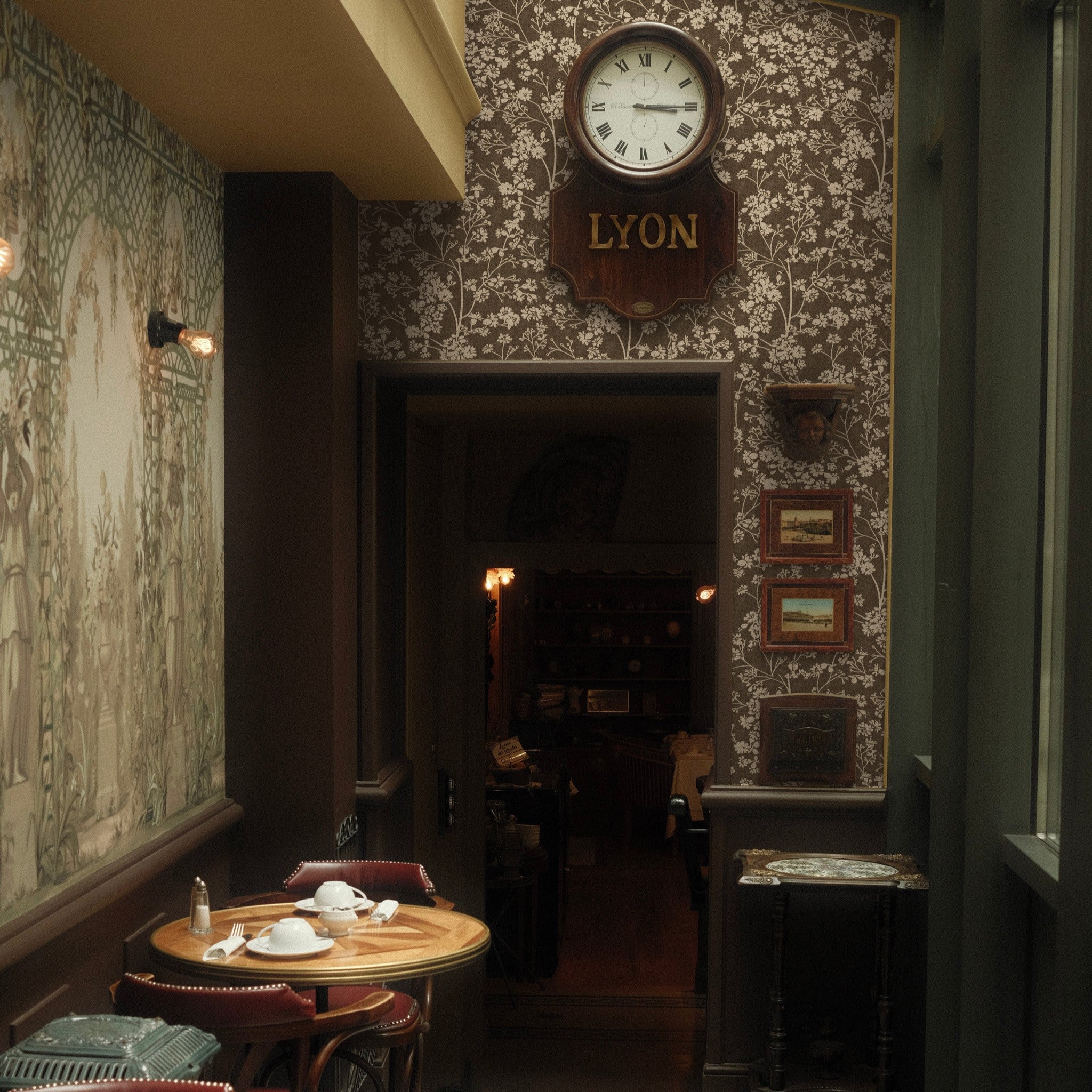 "Elegant Burnett Wallpaper by Wall Blush featured in a stylish dining room with vintage decor and cozy ambiance."