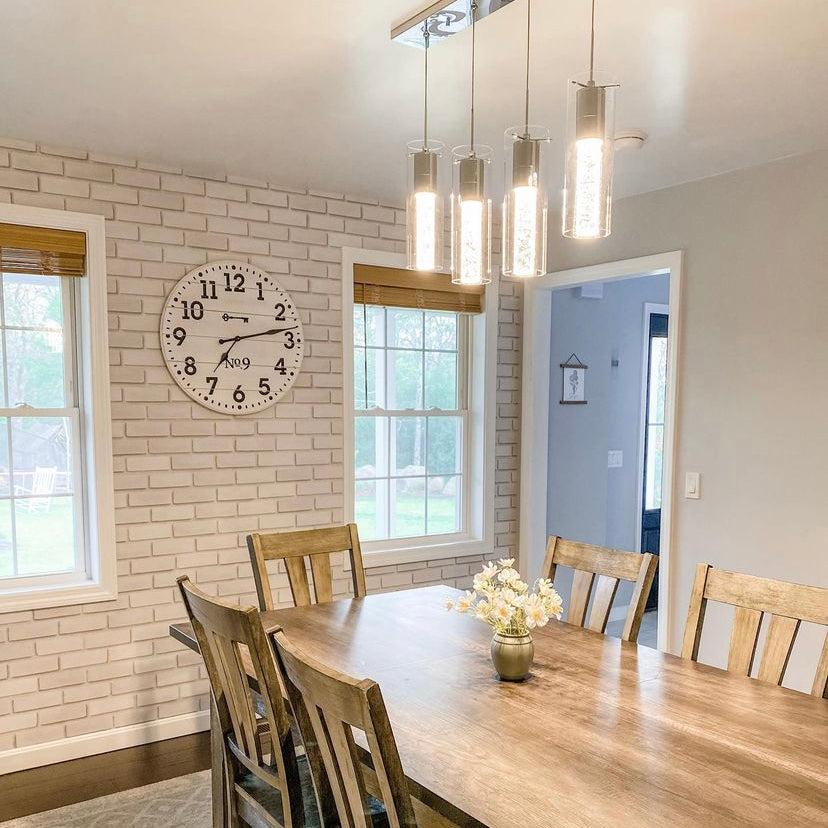 Bella Brick (White) Wallpaper by Wall Blush in a cozy dining room setup, highlighting the textured wall.