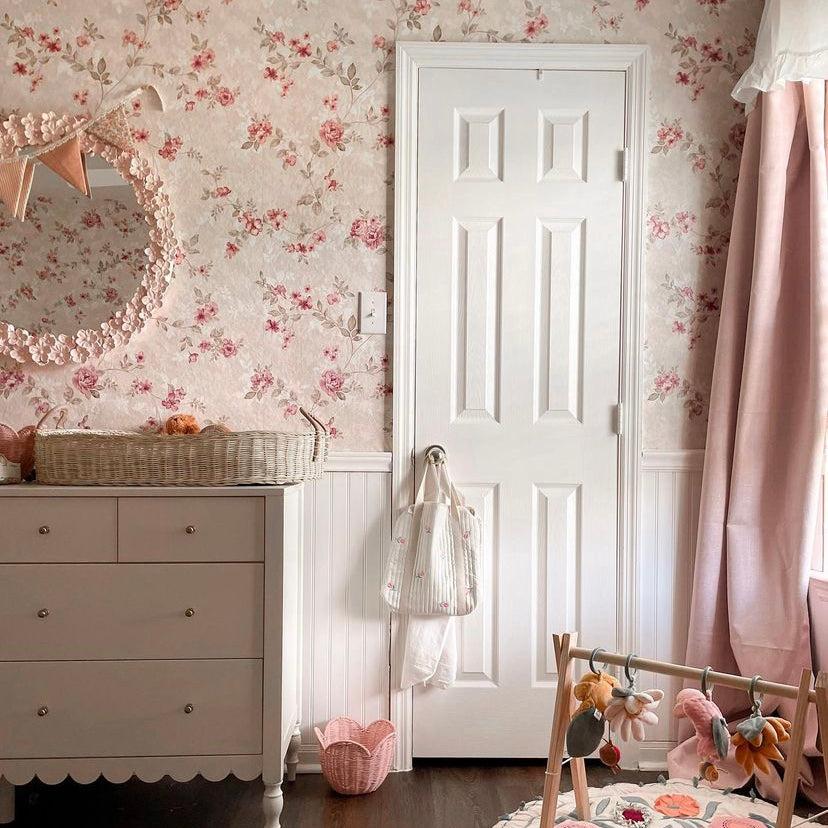 Coco's Cottage Wallpaper by The 7th Haven in a cozy nursery room, showcasing floral patterns as the focal point.