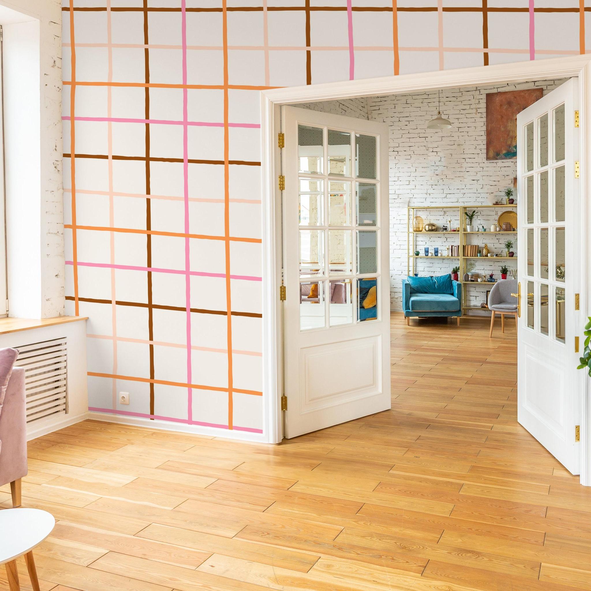 Modern living room featuring Jojo Wallpaper design, Wall Blush SG02, with vibrant grid pattern.