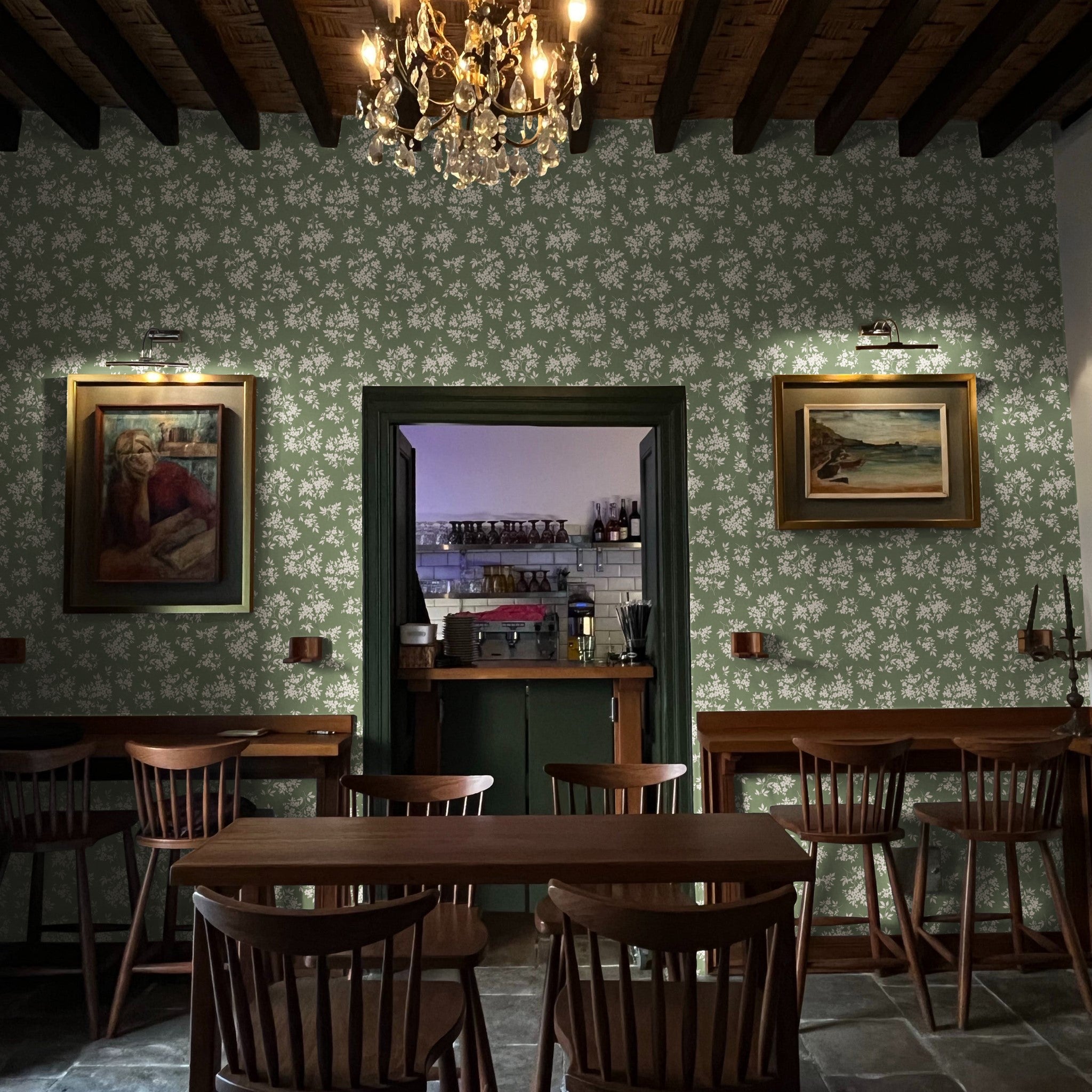 "Wall Blush Kingston Wallpaper in a cozy cafe setting with elegant furniture and lighting fixtures."