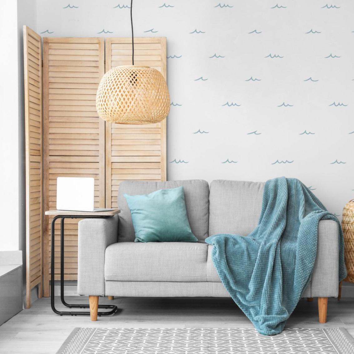 Waves of Blue wallpaper by Wall Blush AW01 in a cozy living room setting with stylish furniture.
