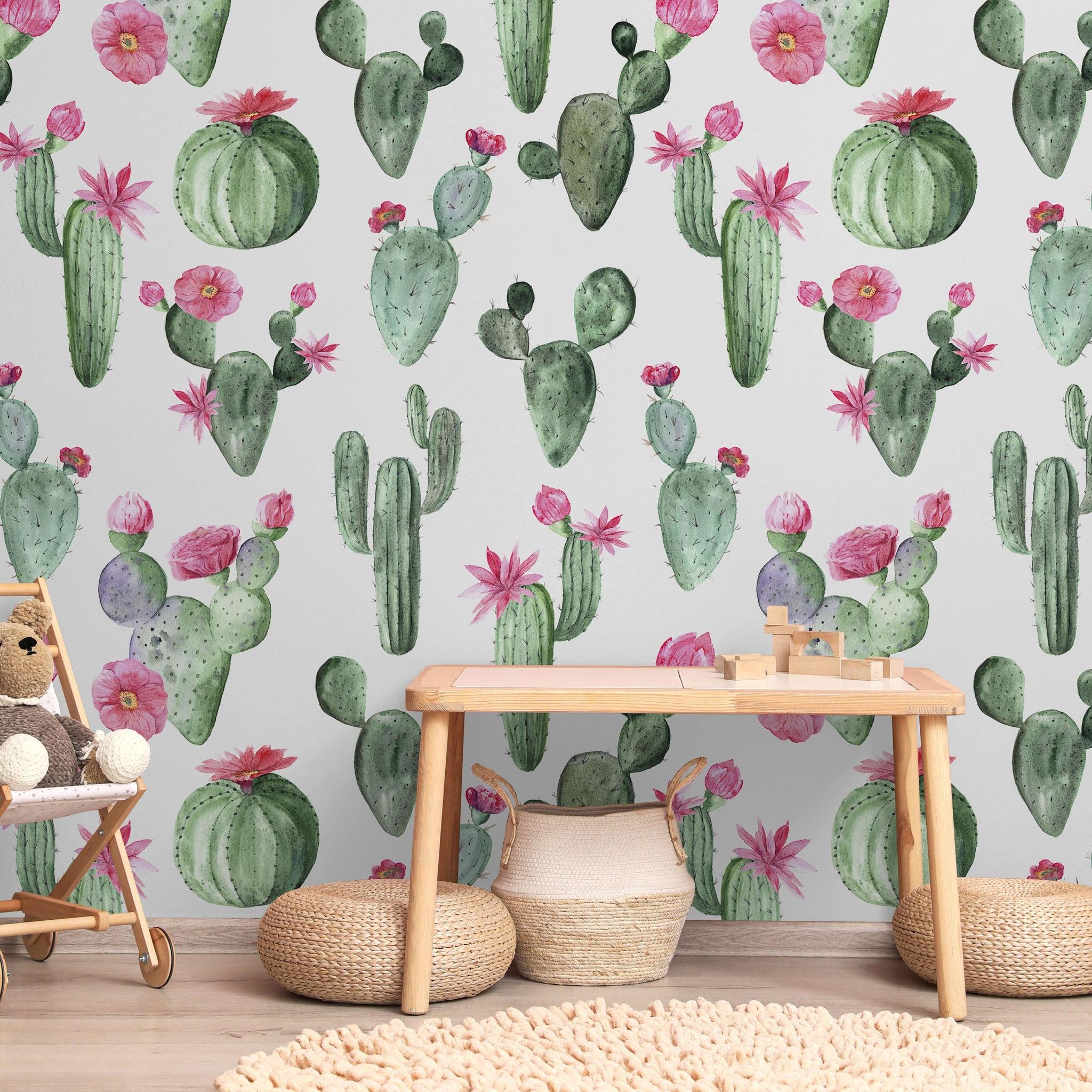 Wall Blush's Prickly Princess Wallpaper in a cozy nursery room, showcasing vibrant cactus patterns.