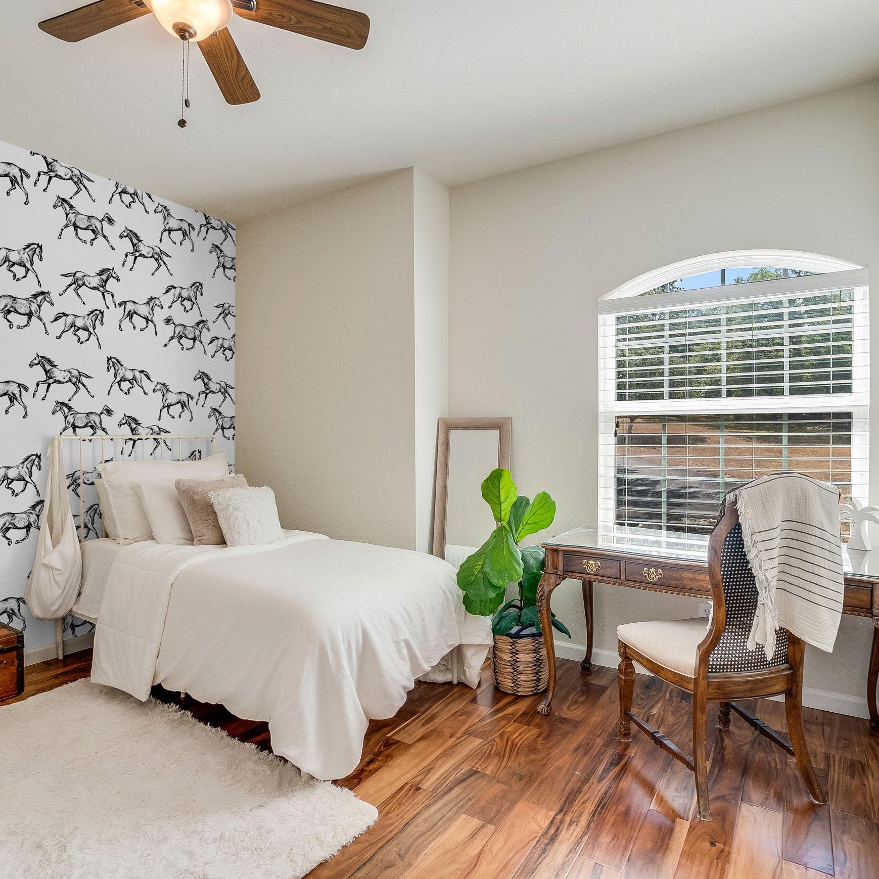 Spirit Wallpaper by Wall Blush SG02 enhances a cozy bedroom's decor with stylish equestrian theme.