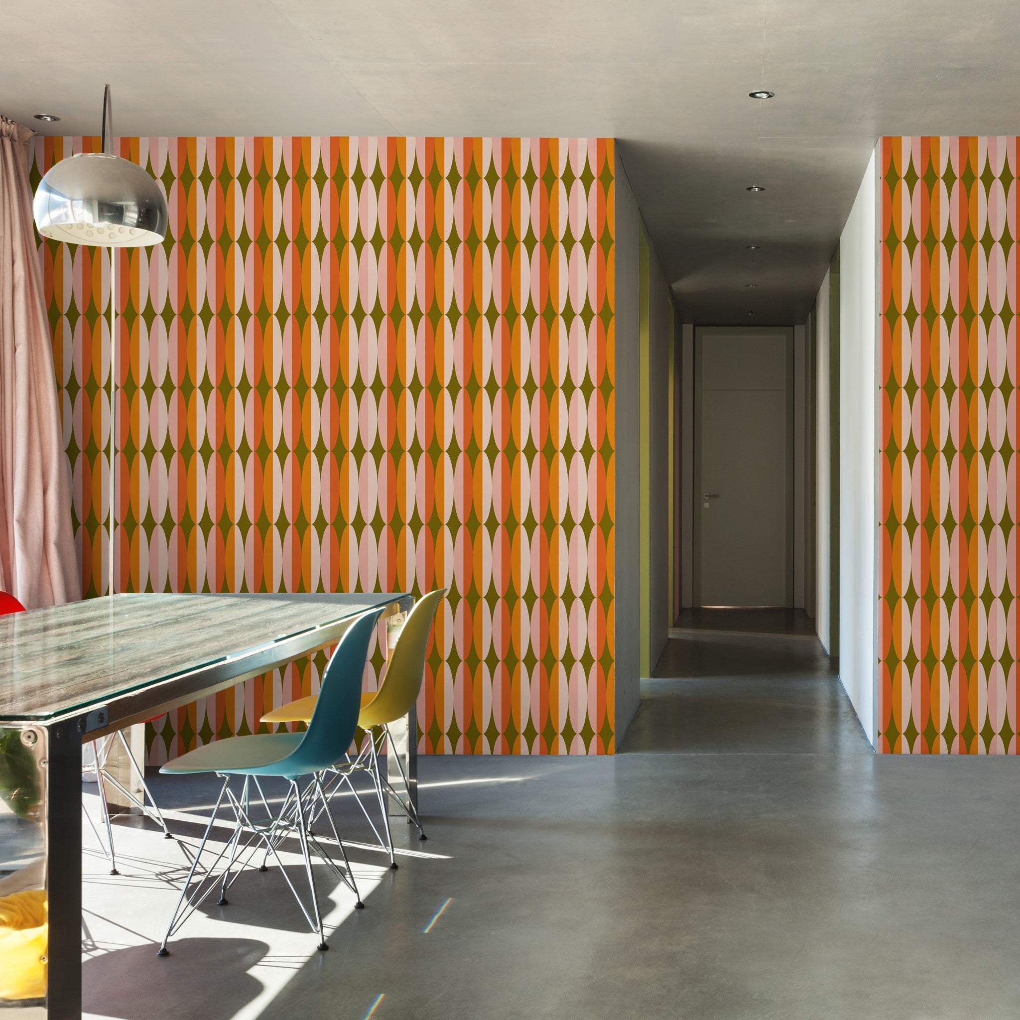 "Wall Blush 'THAT GIRL Wallpaper' featured in modern dining room interior, highlighting vibrant wall decor focus."