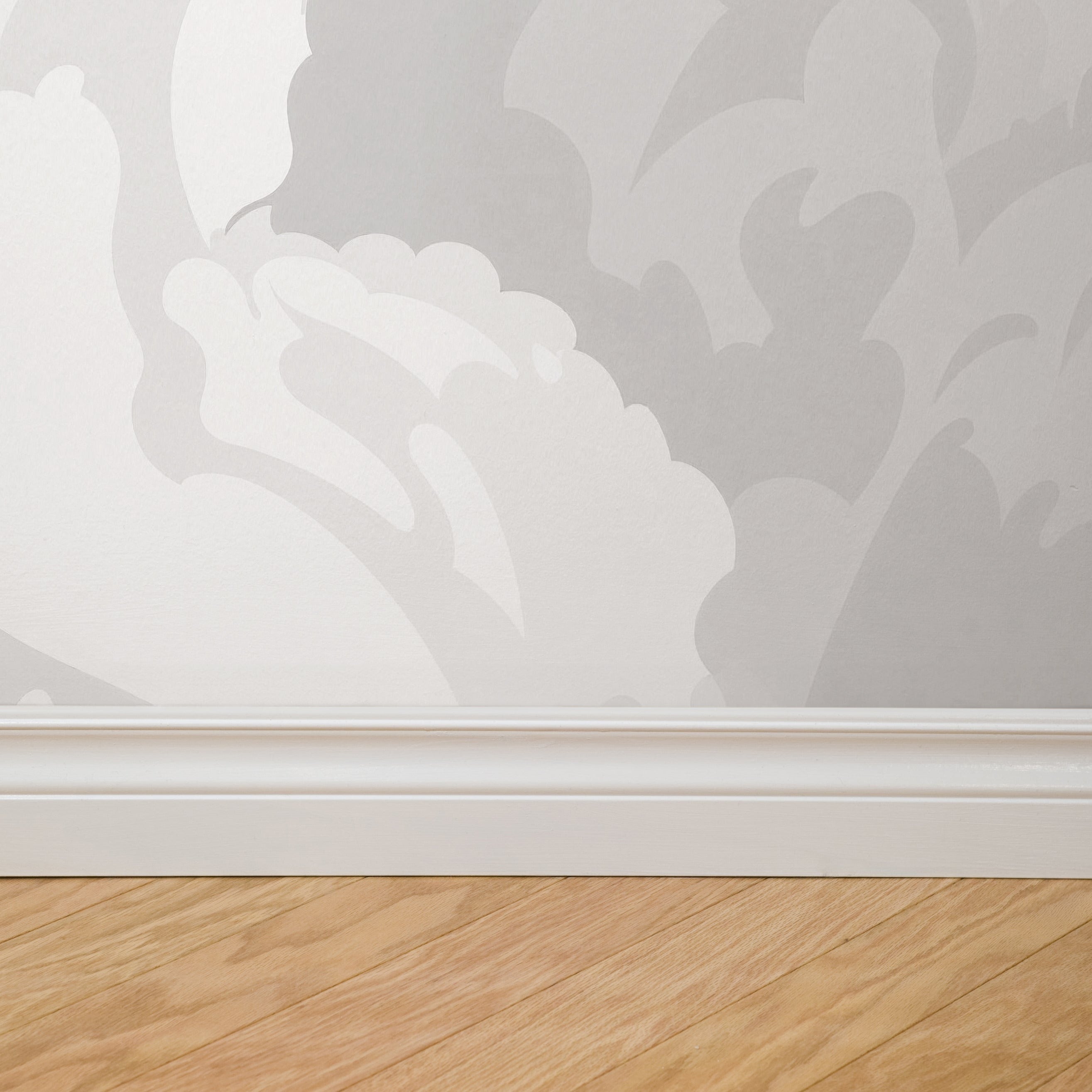 Terra Bloom (Gray) Wallpaper by Wall Blush, elegant floral design in a modern living room setting.