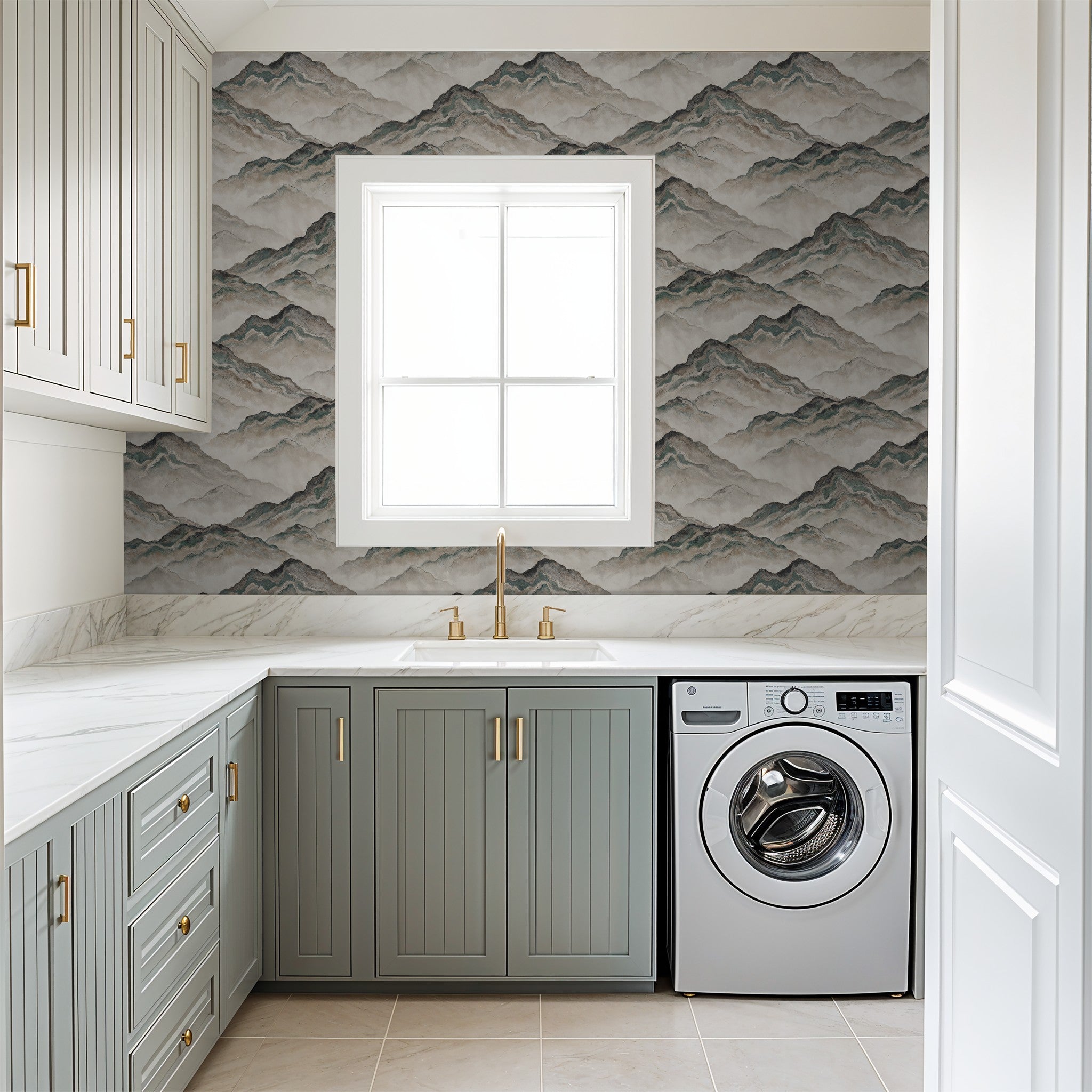 Aurith mountain wallpaper in muted earth tones in a modern laundry room.