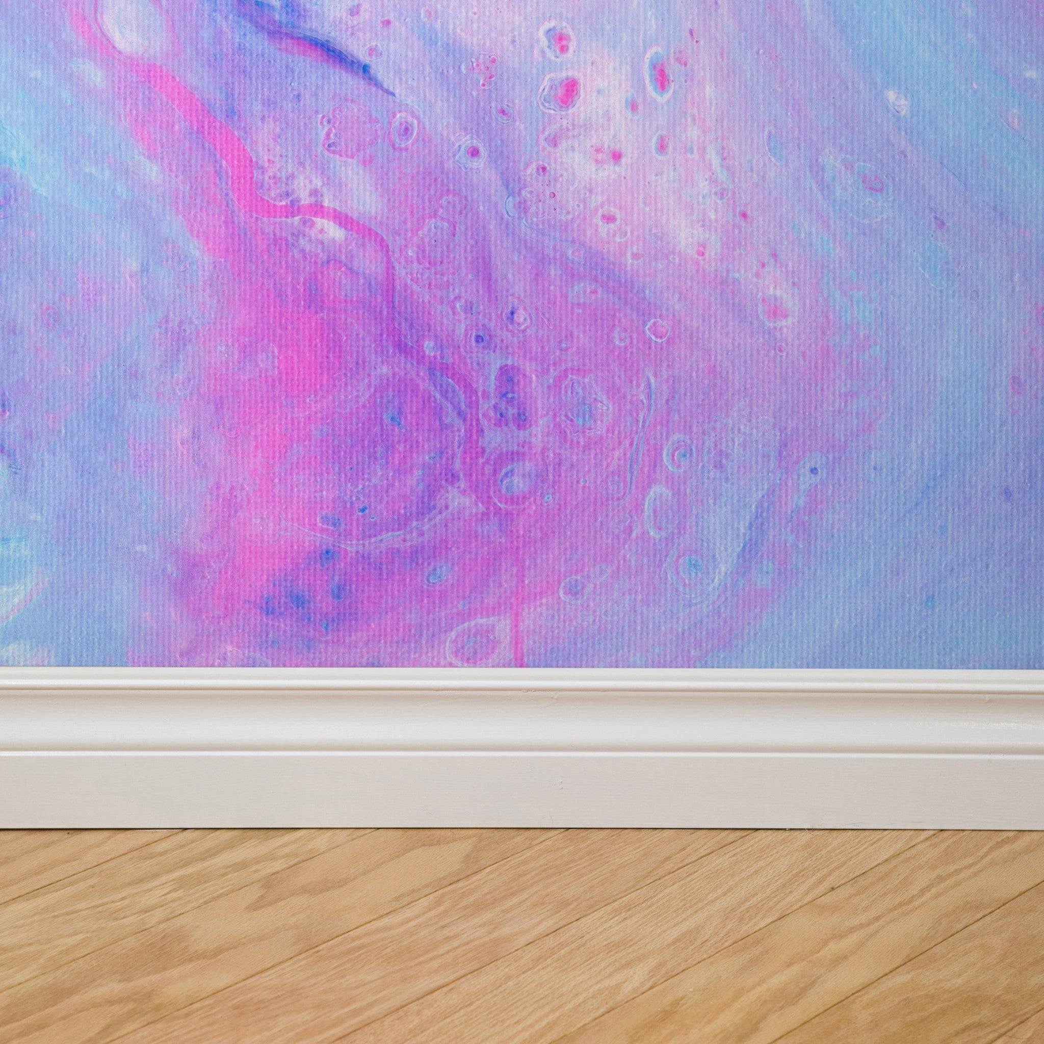 "Malibu Wallpaper by Wall Blush, featuring a colorful marble pattern in a modern home interior setting."