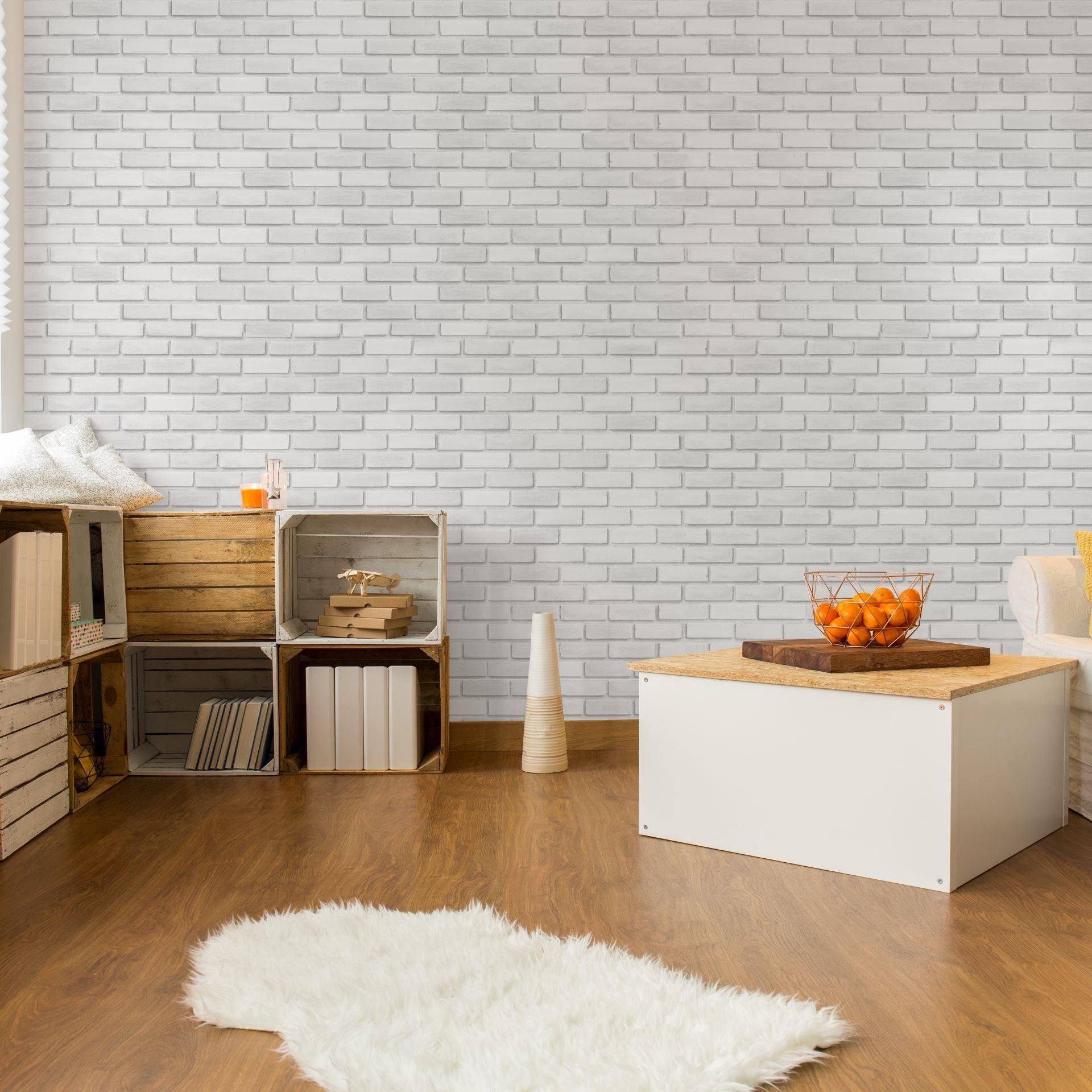 Bella Brick (White) Wallpaper by Wall Blush in cozy living room with rustic decor and wooden accents.