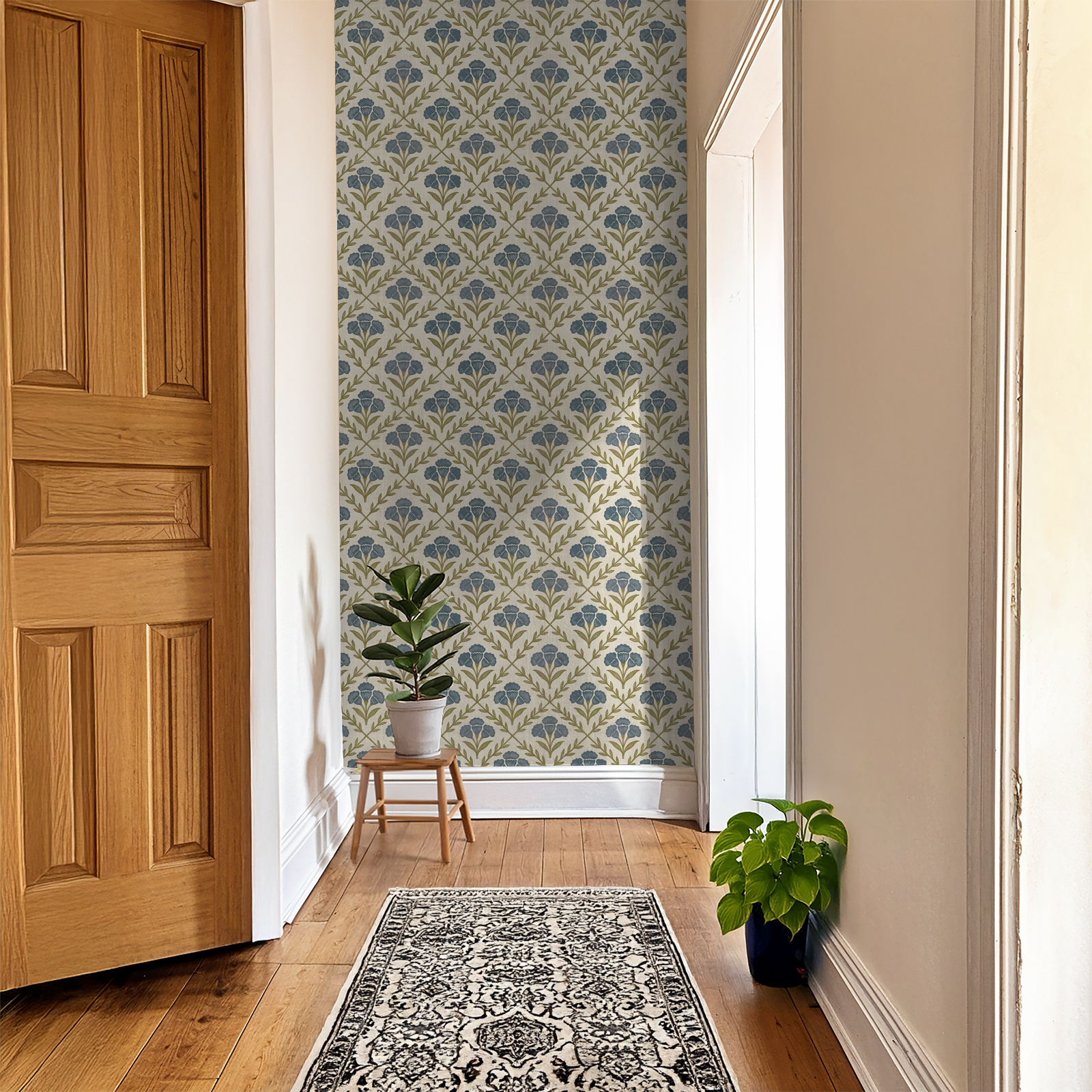 Hallway with blue and olive green floral wallpaper and wooden decor