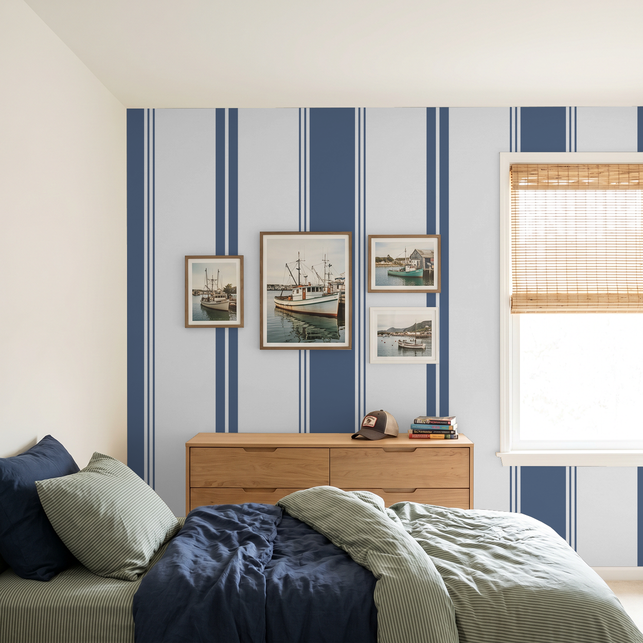 Blue stripe geometric wallpaper in modern bedroom with framed art.