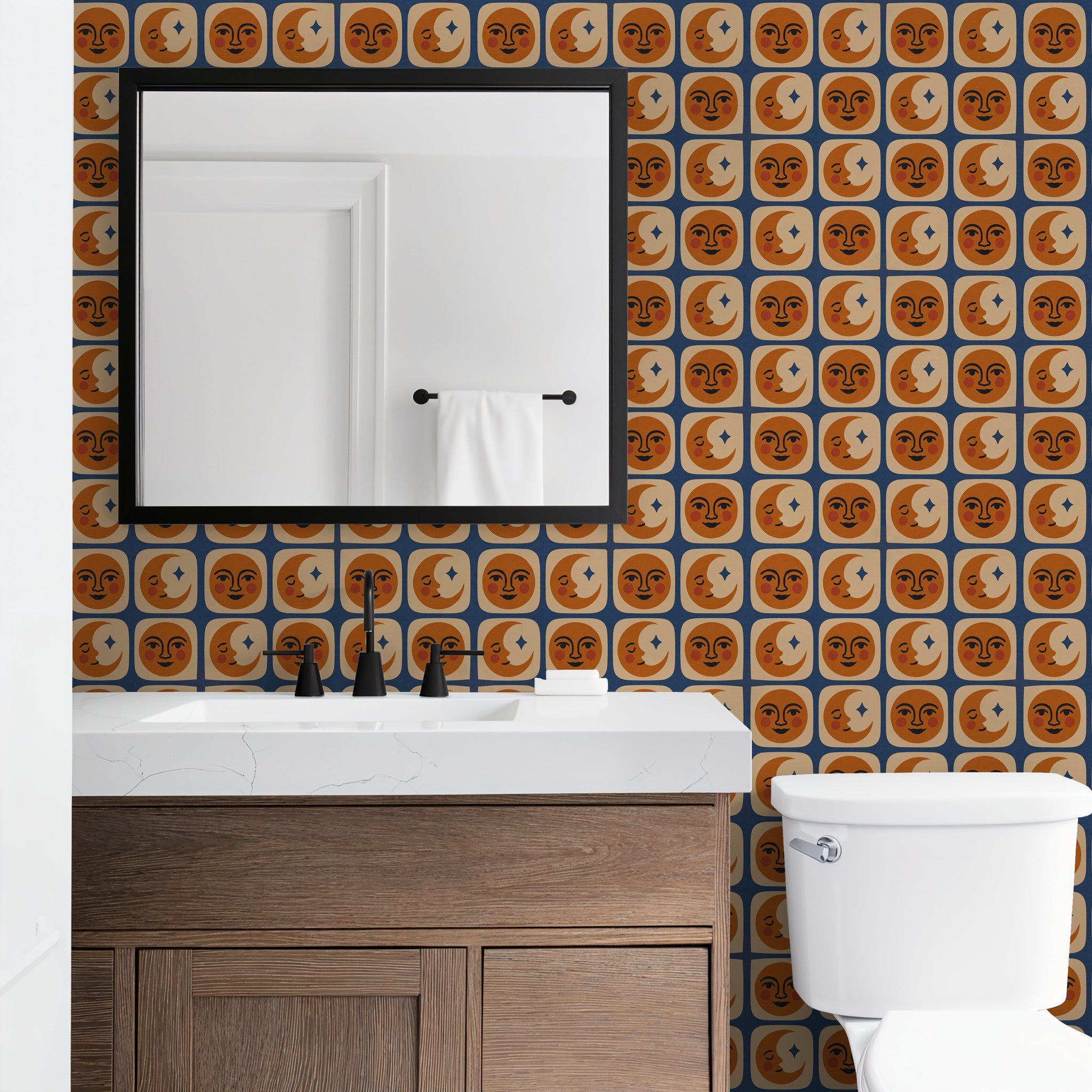 Whimsical celestial wallpaper with terracotta faces and cream moons in bathroom setting.