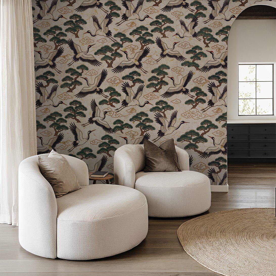 Elegant crane and pine tree wallpaper in modern living room with white chairs.