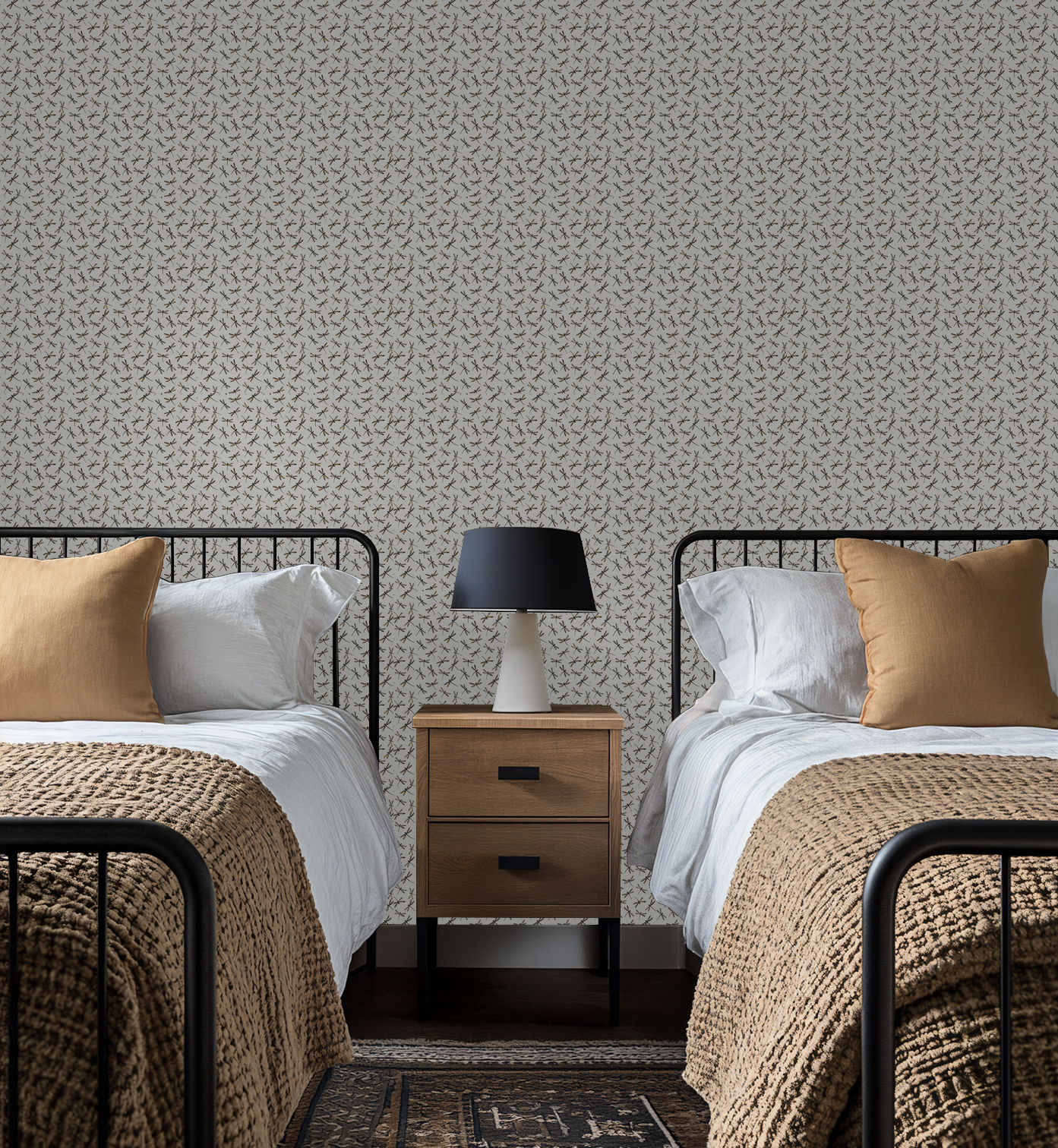 Cream dragonfly pattern wallpaper in a cozy bedroom with twin beds and a nightstand.