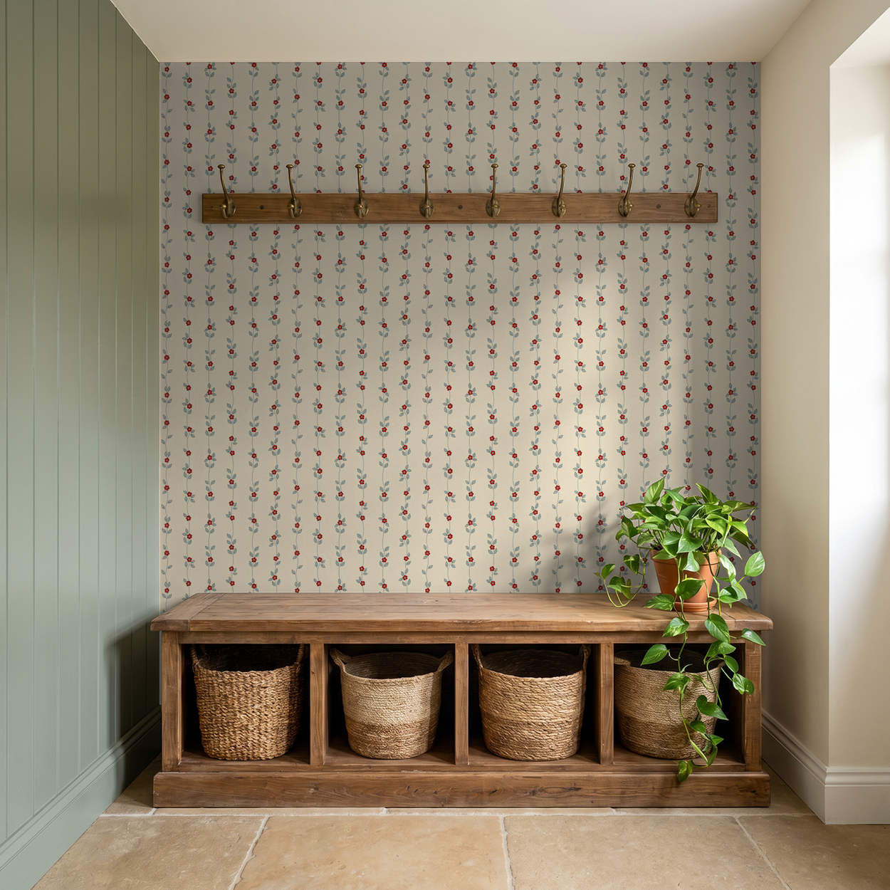 Cream wallpaper with red floral vine pattern in rustic entryway with wooden bench.