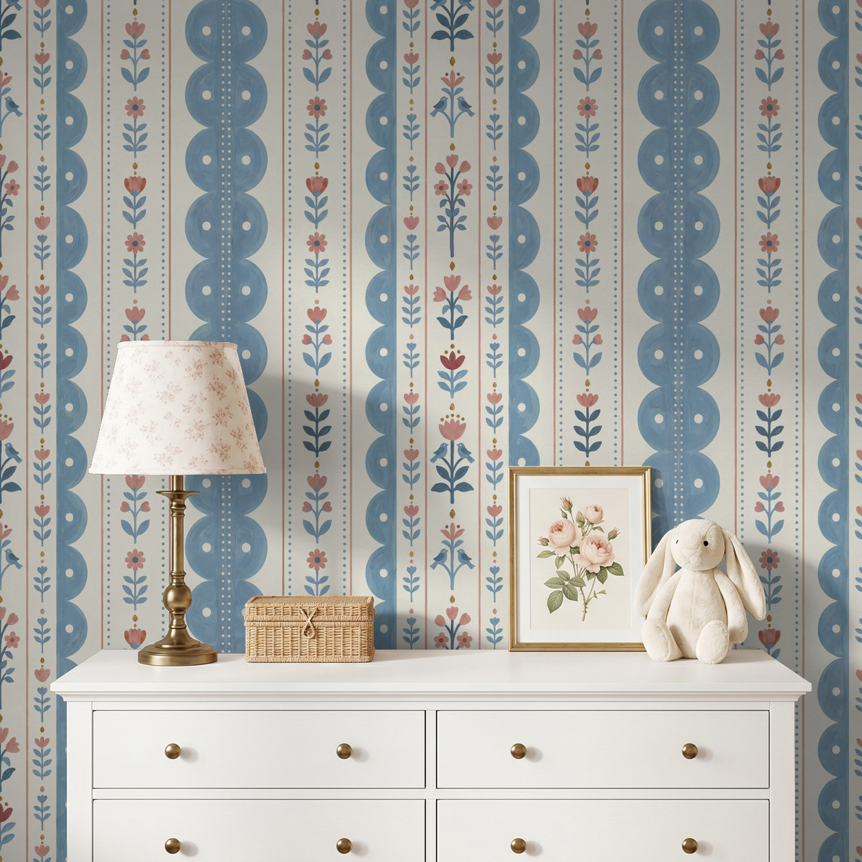 Dahlia Dreams wallpaper with blue and coral floral stripes in a cozy room with white dresser.