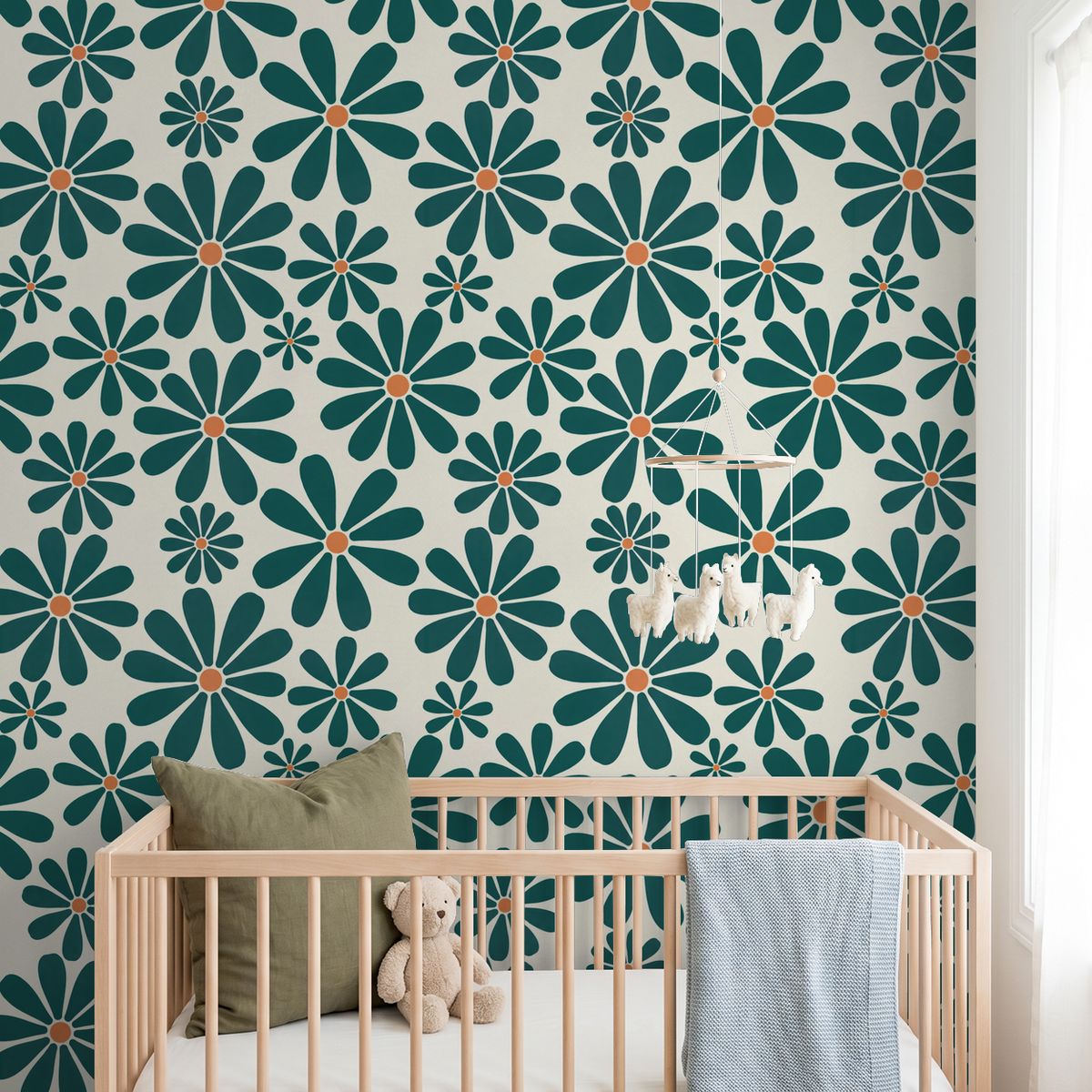 Deep teal floral wallpaper with orange centers in a nursery setting.