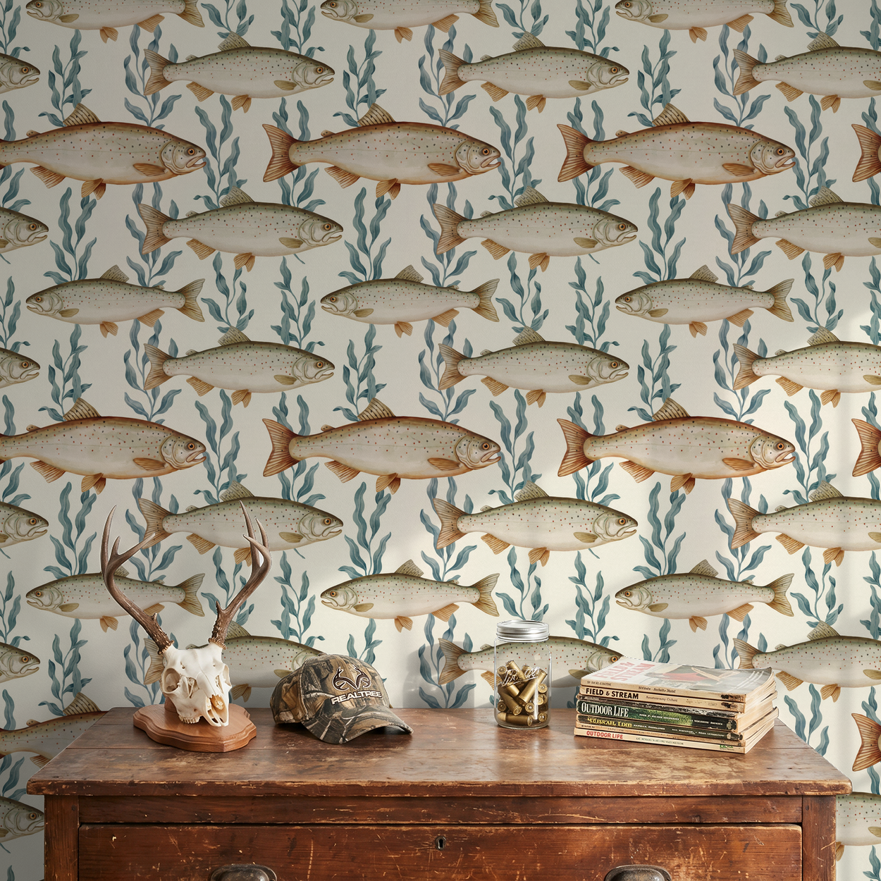 Fish and seaweed wallpaper in rustic room with antler decor