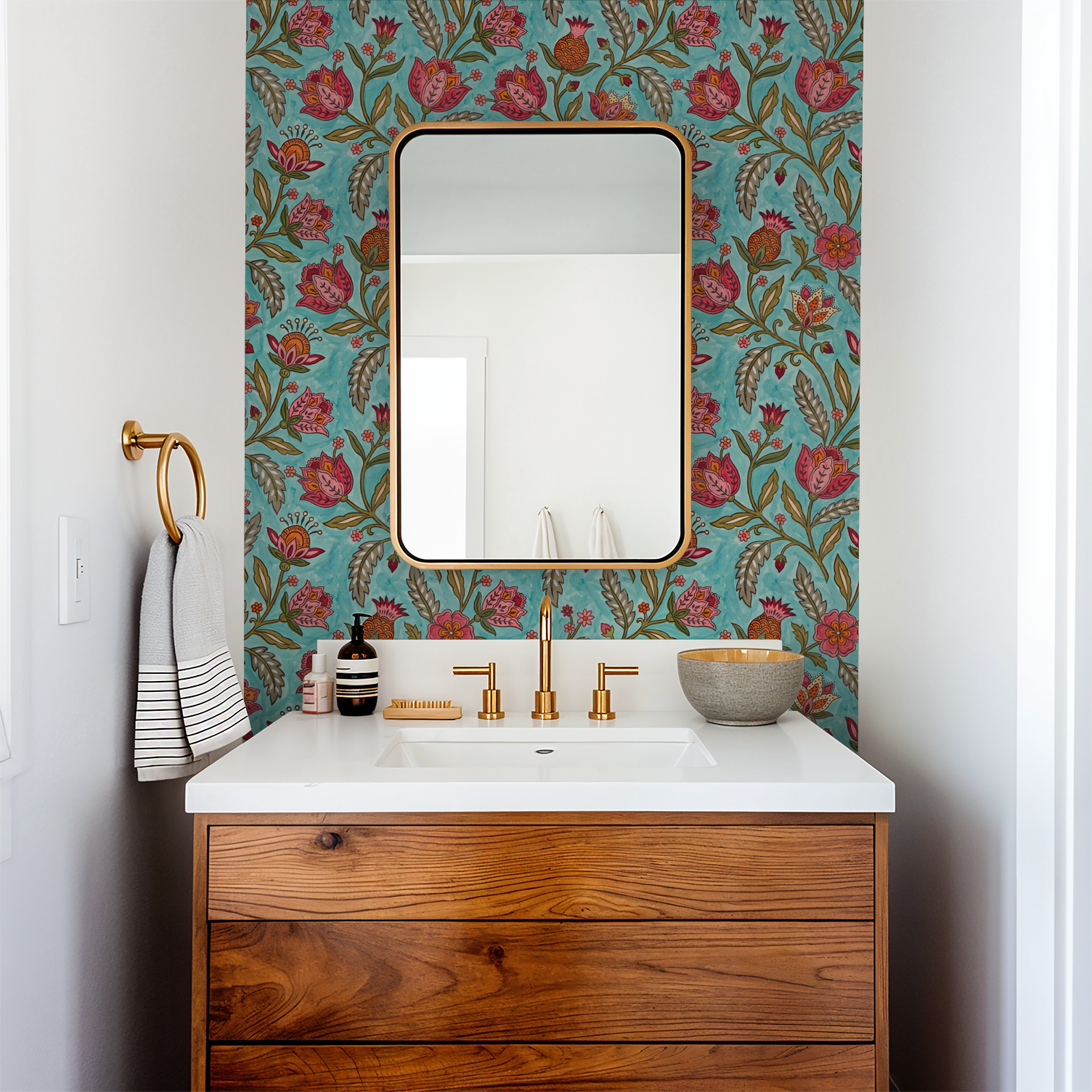 Floral wallpaper with red and orange motifs on teal in a modern bathroom setting.
