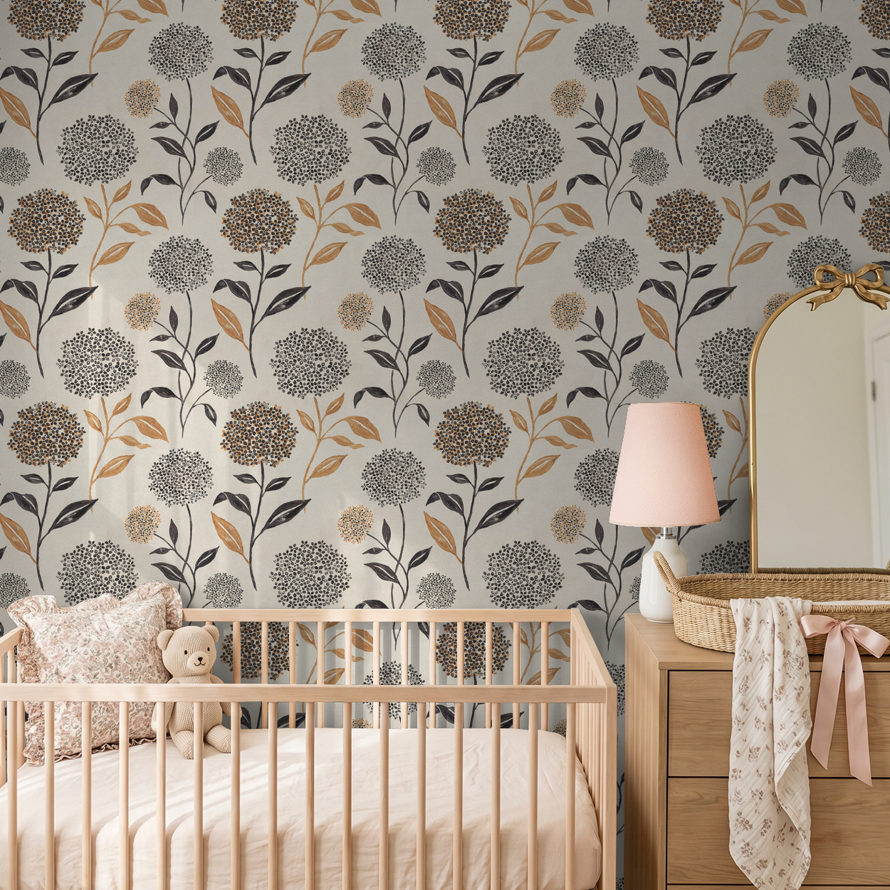 Floral wallpaper with terracotta and charcoal blooms in a cozy nursery setting.