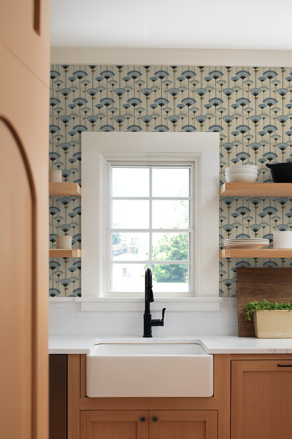 Gilded Petals wallpaper with blue floral pattern in modern kitchen setting.