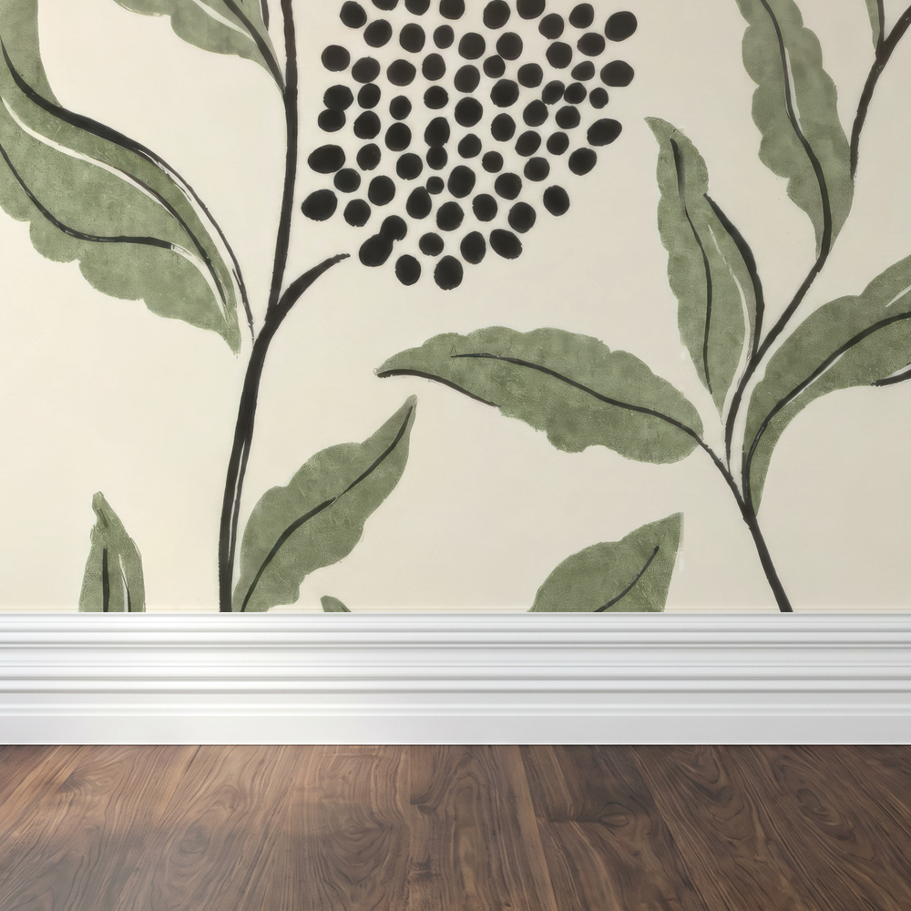 Green botanical wallpaper with sage leaves and charcoal dots in a modern room setting.