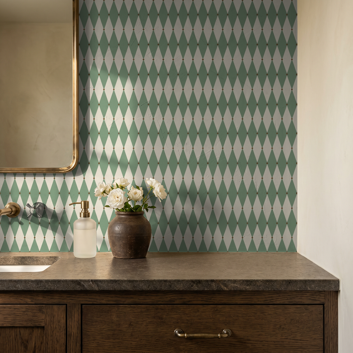 Green and cream diamond pattern wallpaper in a bathroom setting with a mirror and flowers.