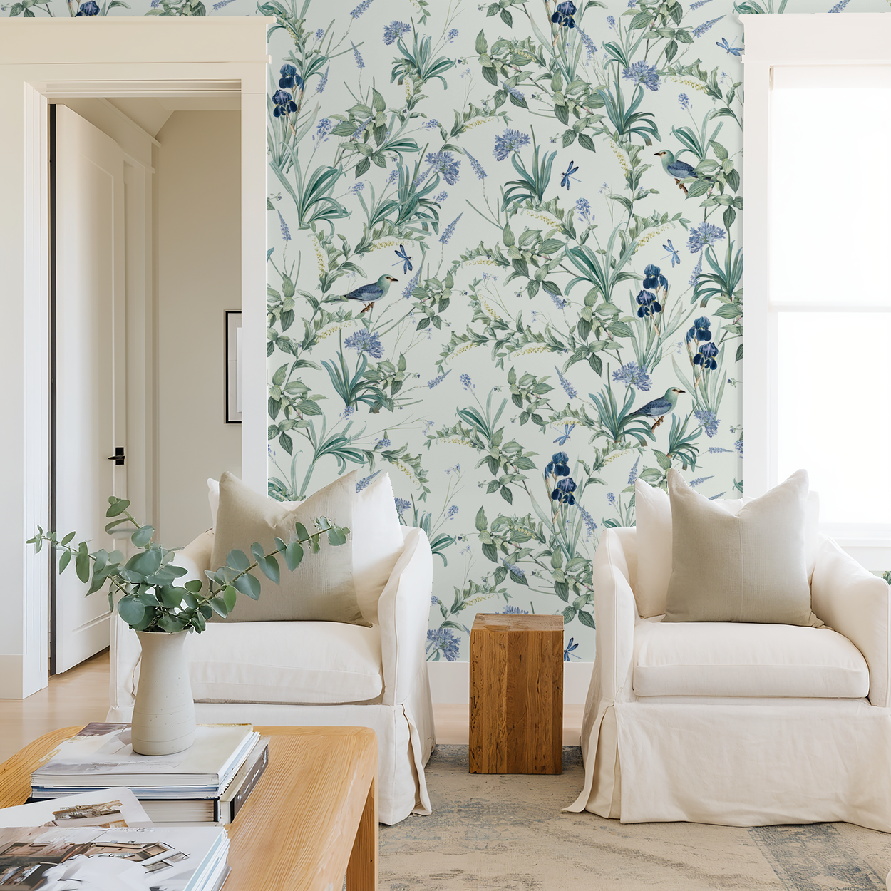 Mint floral wallpaper with birds and botanicals in a cozy living room setting.