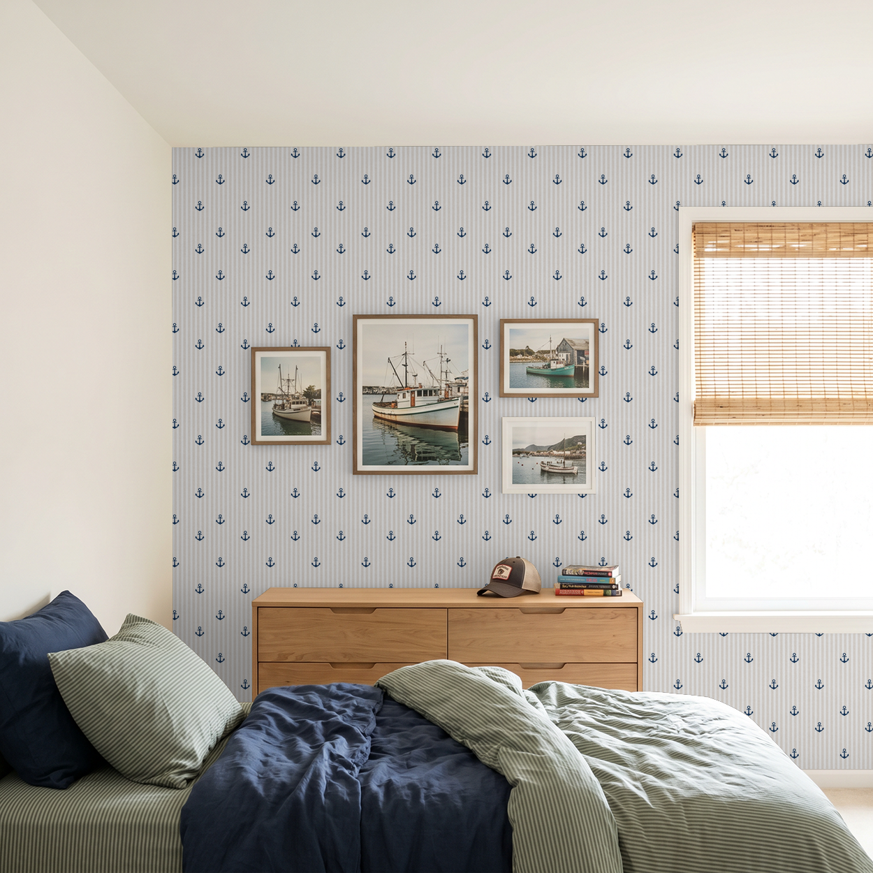 Nautical anchor wallpaper in tan and navy in a coastal bedroom with boat decor.