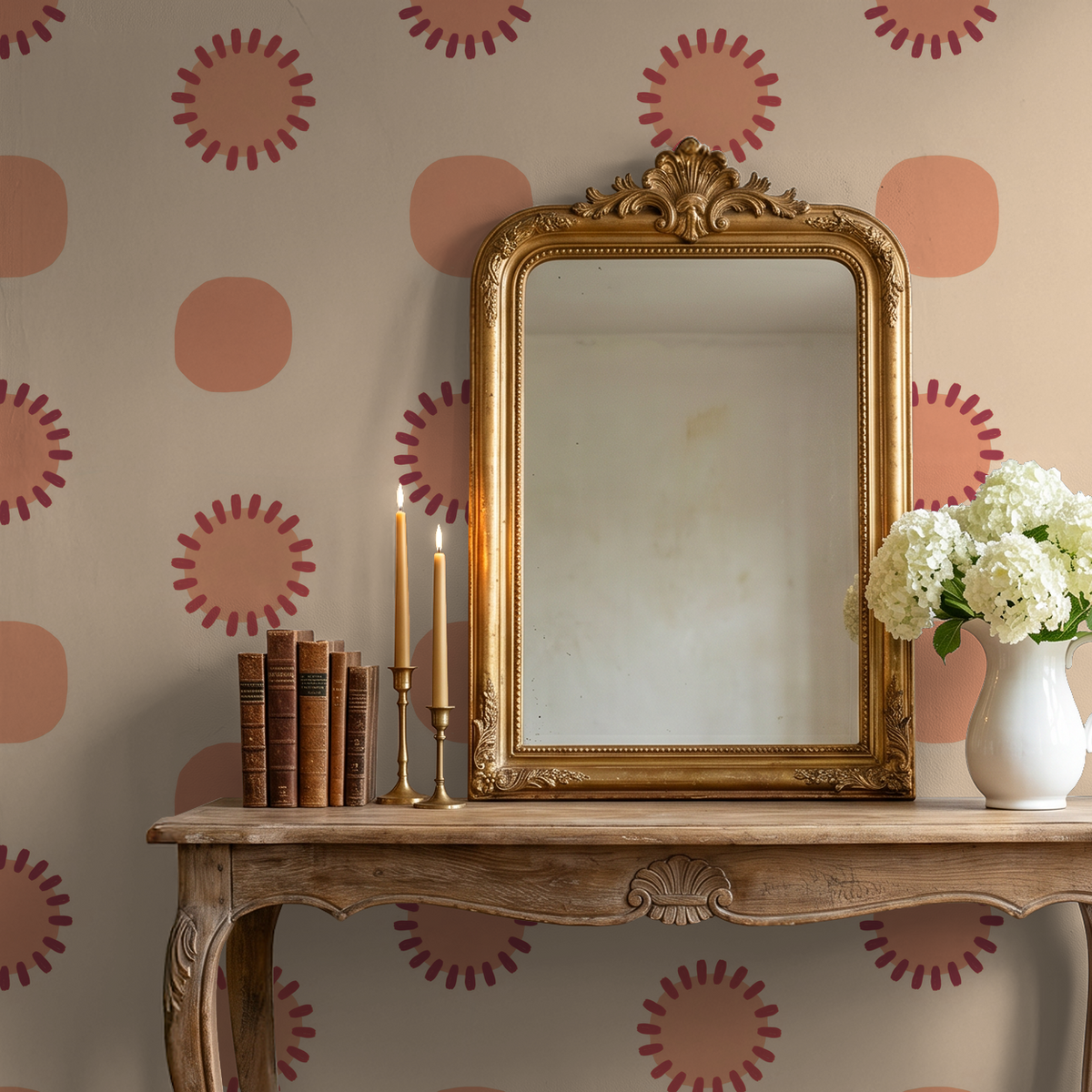 Peach circle and sunburst wallpaper in elegant room with mirror and flowers.