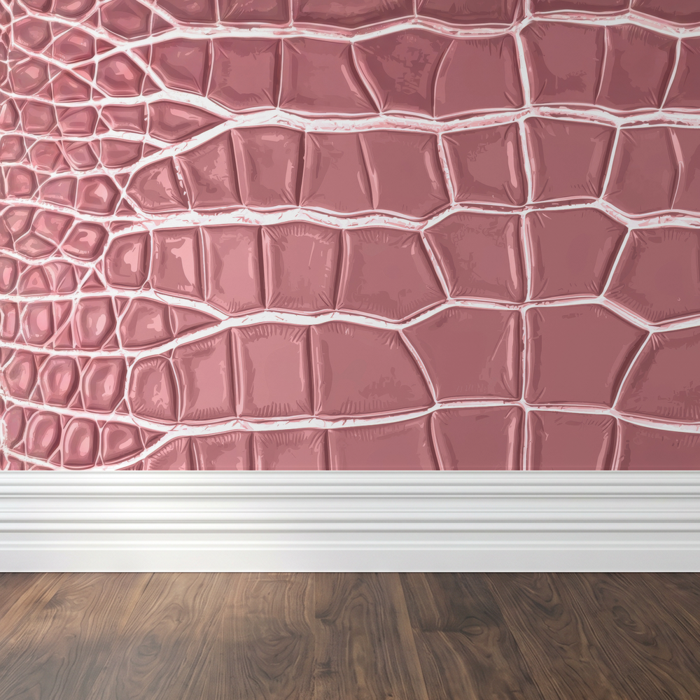 Pink crocodile textured wallpaper in a modern room setting with wooden floor.