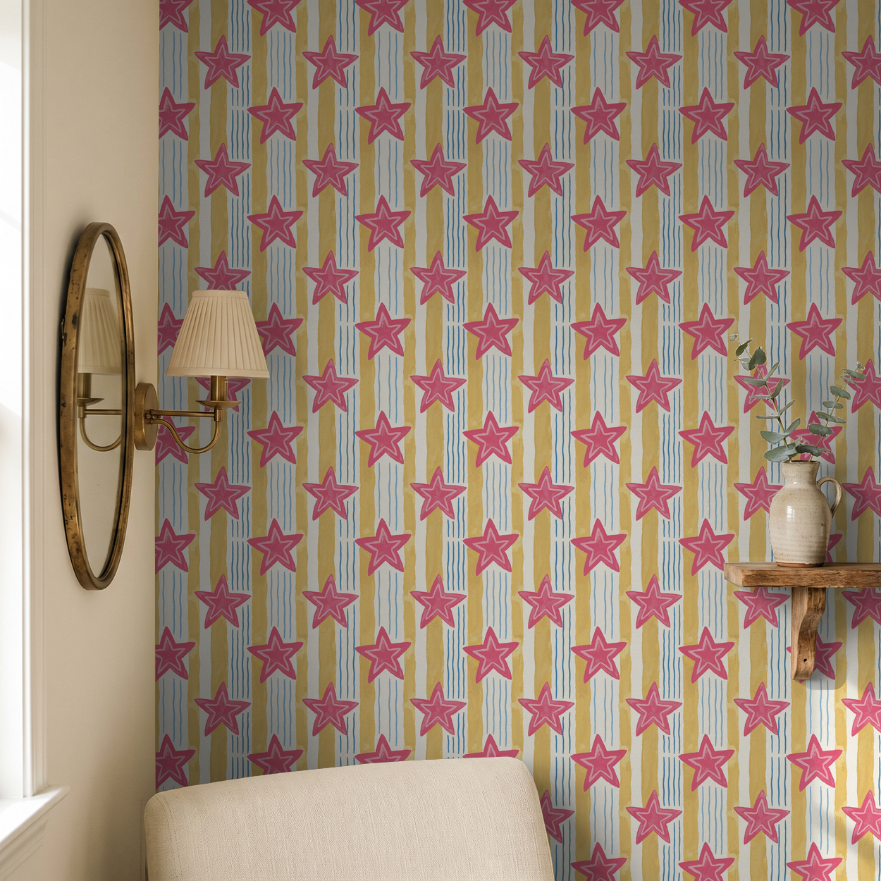 Pink star wallpaper with yellow and blue stripes in cozy room setting.