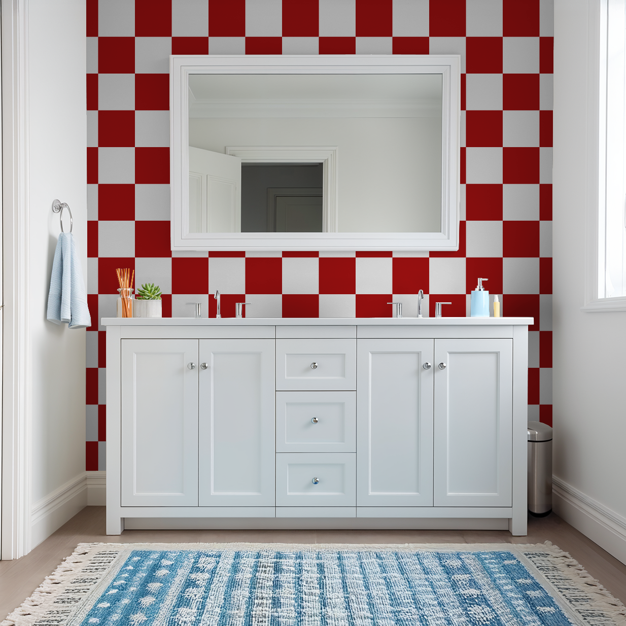 Bathroom with red and white checkerboard wallpaper and white vanity.