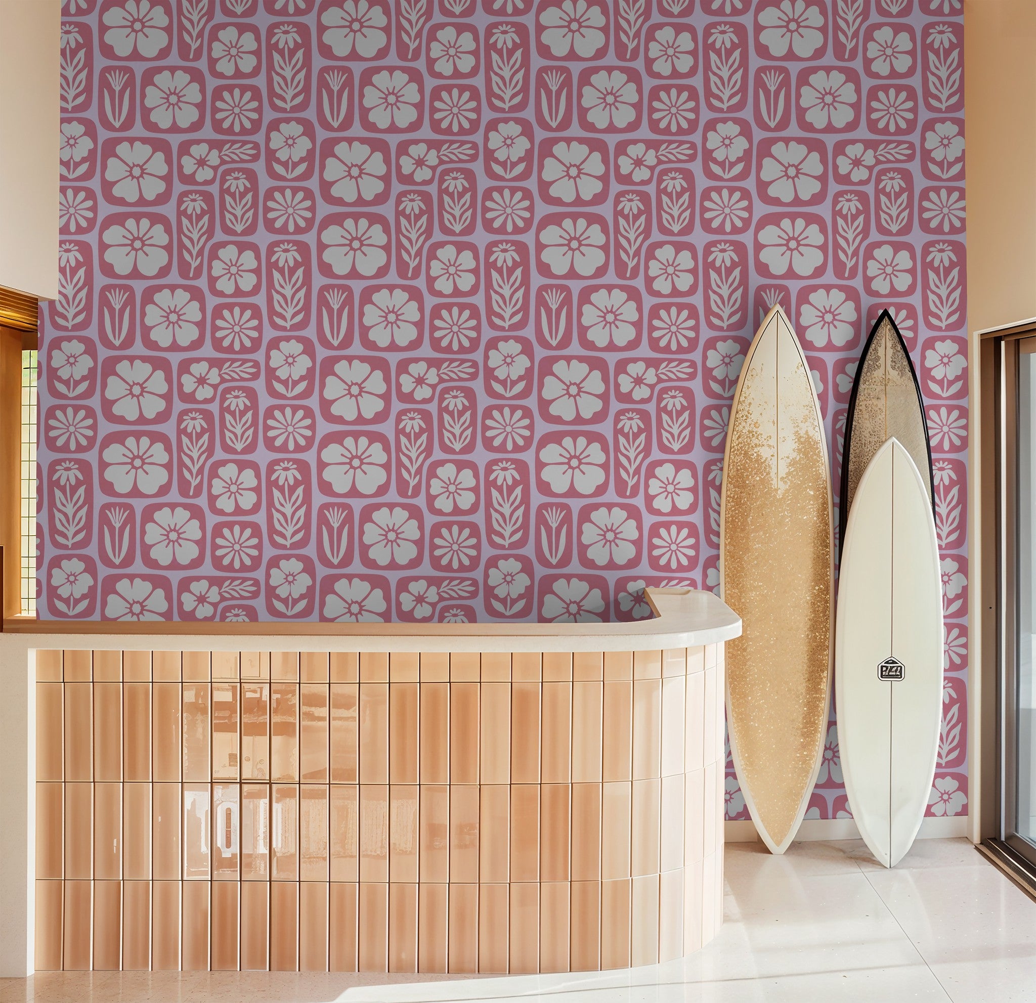 Retro pink floral wallpaper with surfboards in a modern room setting.