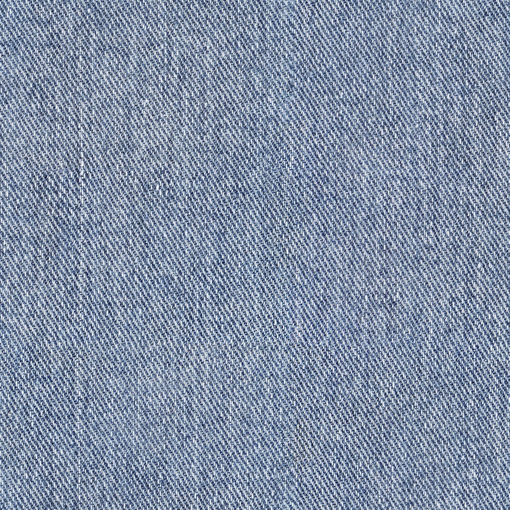 "Wall Blush brand Levi Wallpaper with a denim texture design installed in a modern living space, focus on wallpaper detail."