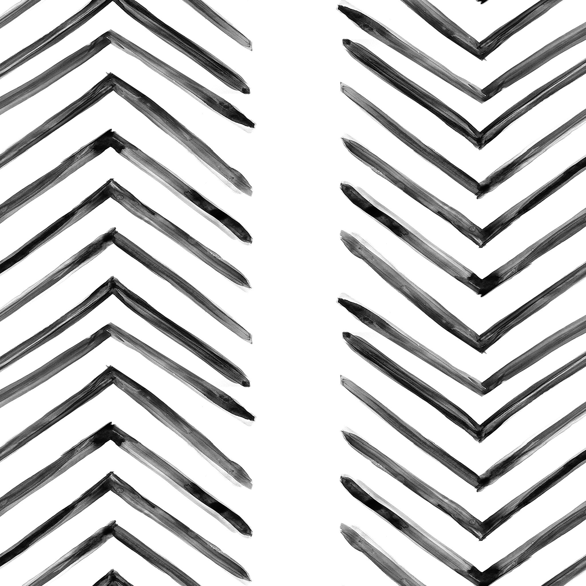 "Modern Ar-row Wallpaper by Wall Blush in stylish living room, focus on black and white chevron pattern."