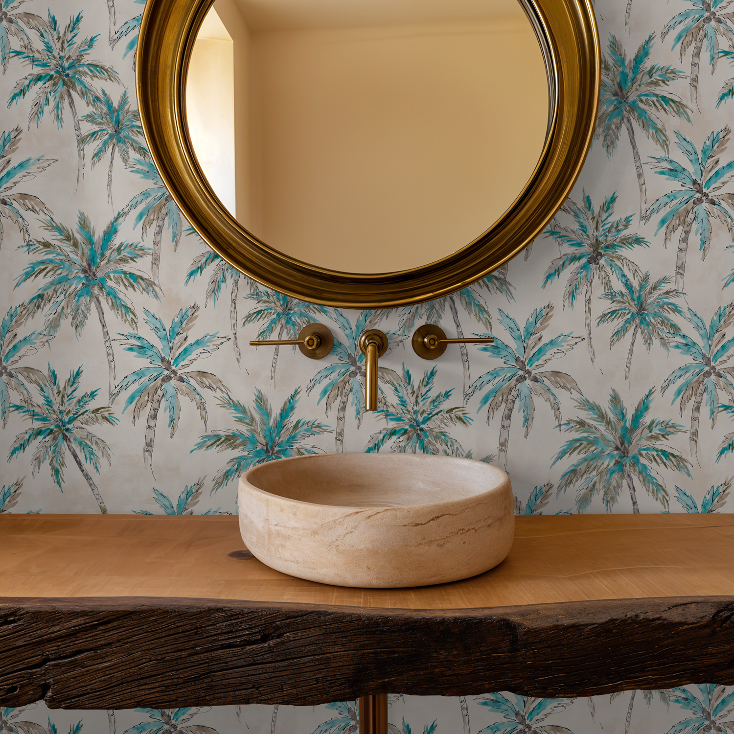 Tropical palm tree wallpaper in bathroom with round mirror and wooden sink.