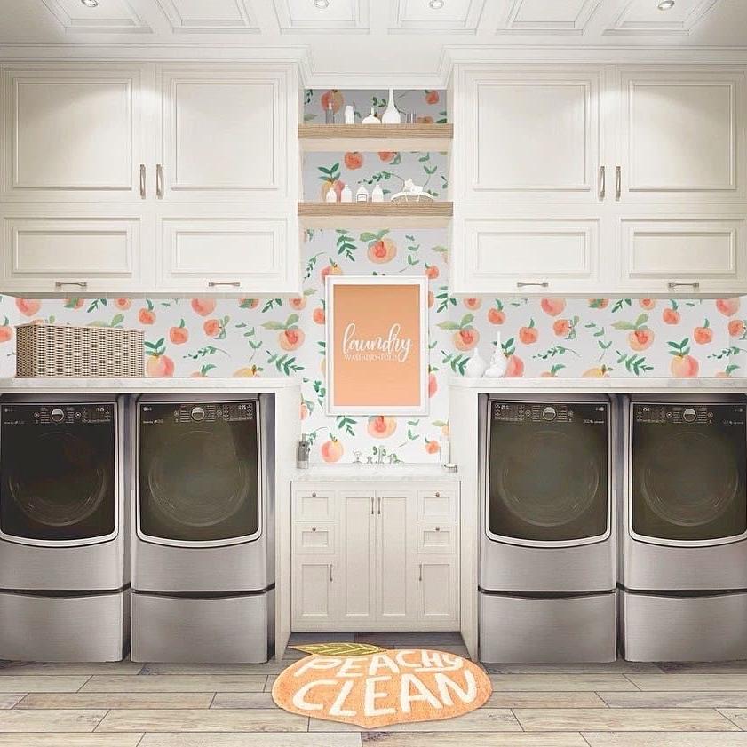 Peachy Clean Wallpaper by Wall Blush, brightening a modern laundry room with fruit motifs.