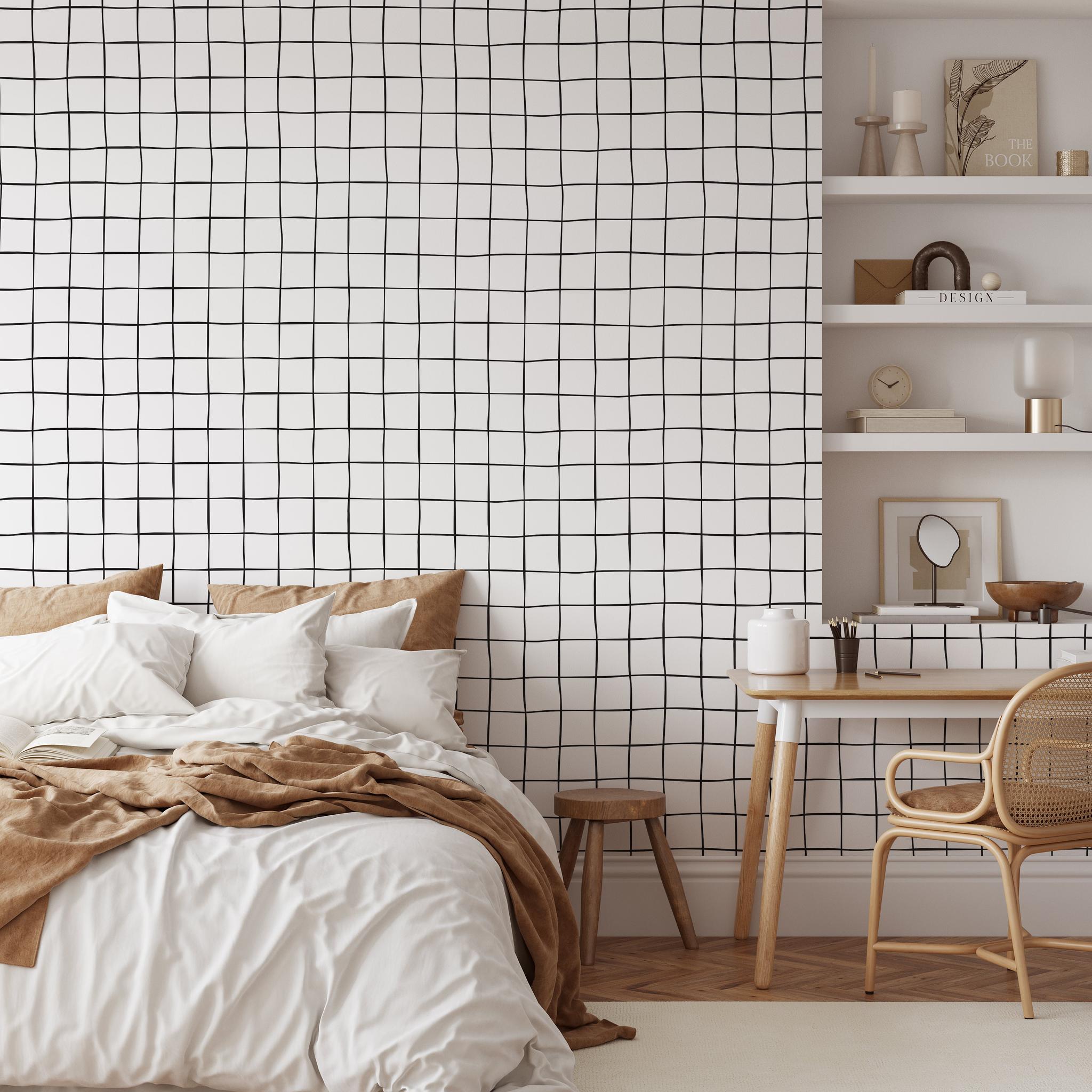 "Buxton Wallpaper by Wall Blush in a contemporary bedroom showcasing the modern grid pattern design."