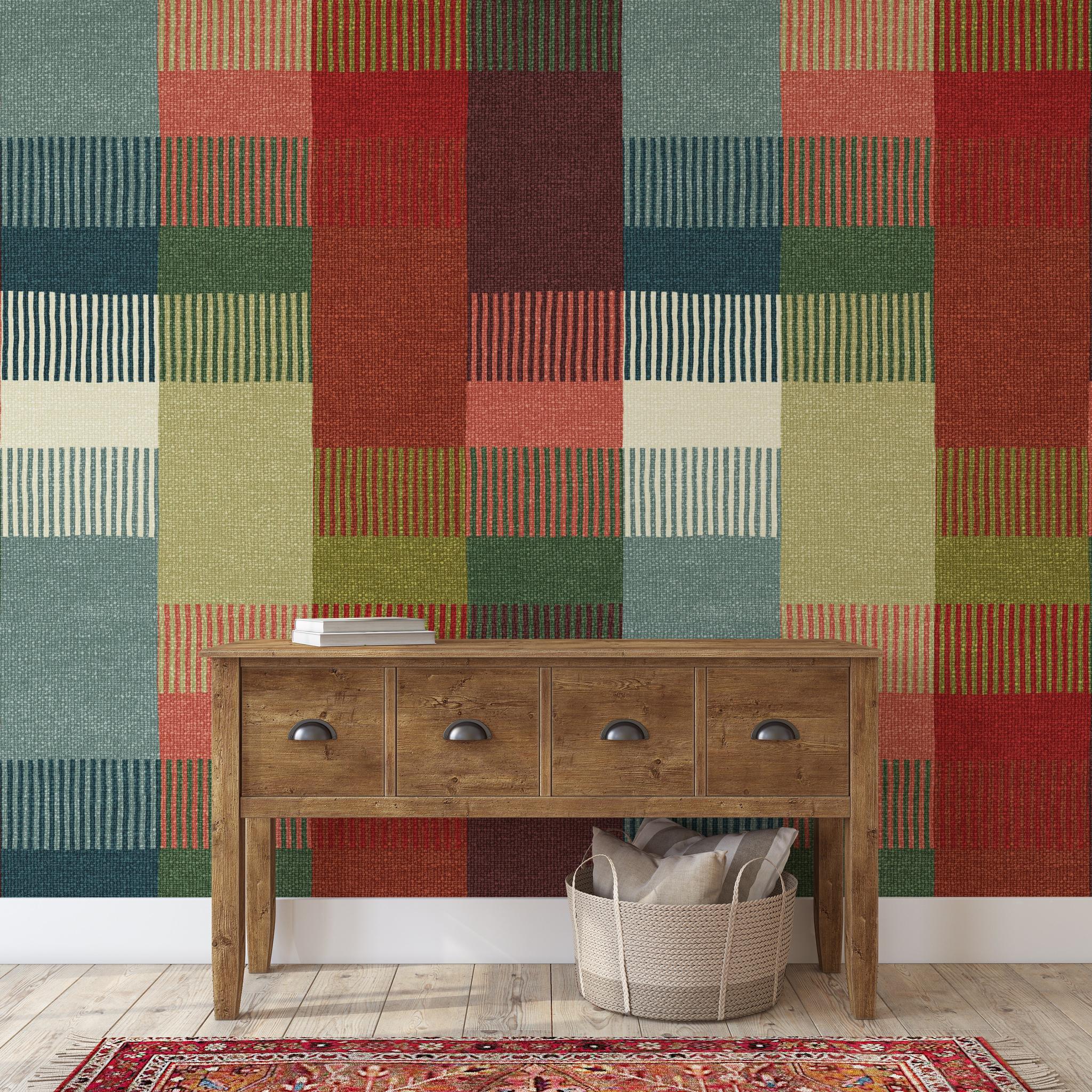 "Wall Blush Chelsea Wallpaper in a stylish living room with wooden console table and patterned rug, emphasizing bold design."