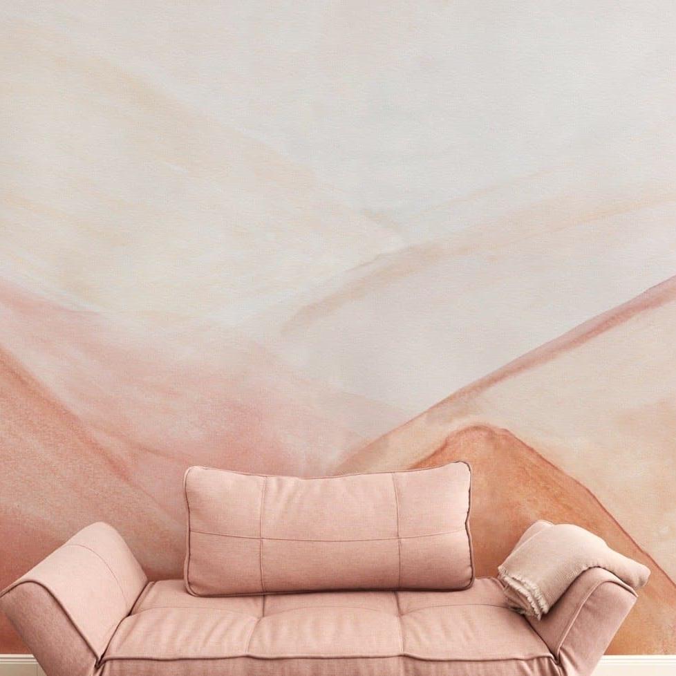 Unruly Wallpaper by The Minty Line in living room with pink tones and modern couch focused on wall decor.
(Note: Based on the image provided, it looks like the room could be a living room due to the presence of the couch, and I have assumed that the couch is modern-style due to its design. The description includes the product title and the brand, and it emphasizes the wallpaper as the focal point.)