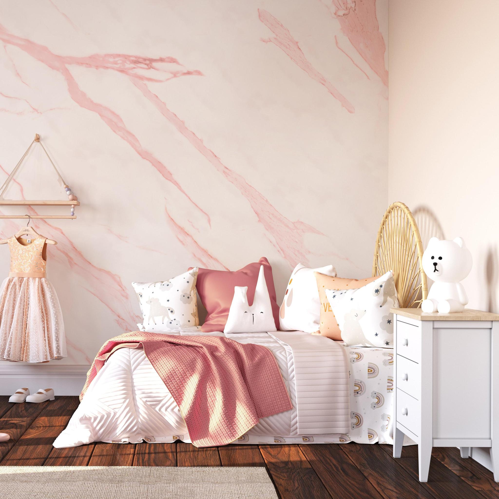 Alt text: Ethereal Wallpaper from The Clements Crew Line in a stylish child's bedroom, showcasing the elegant pink marble pattern as a focal point.