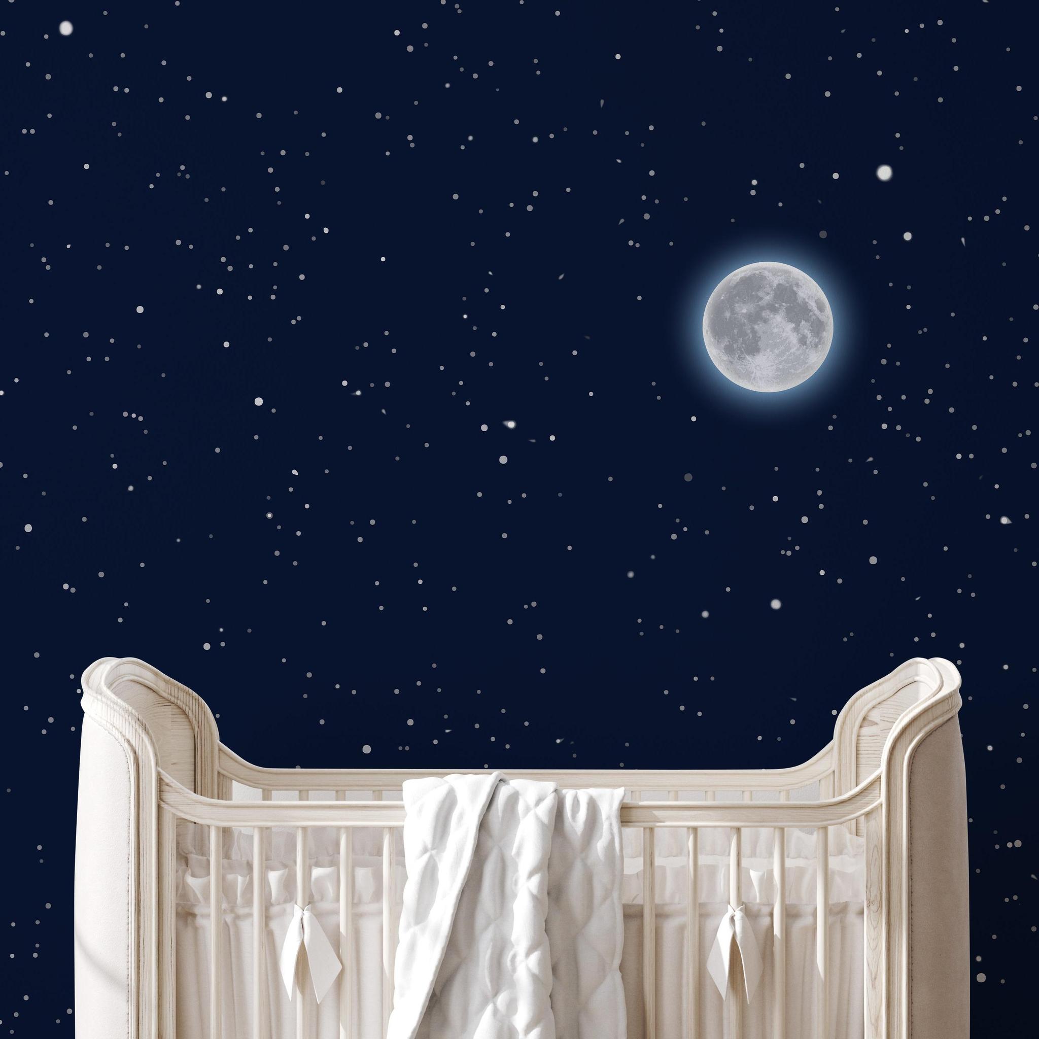 Wall Blush's Moonlight Wallpaper in nursery room, starry night theme emphasized to enhance decor.