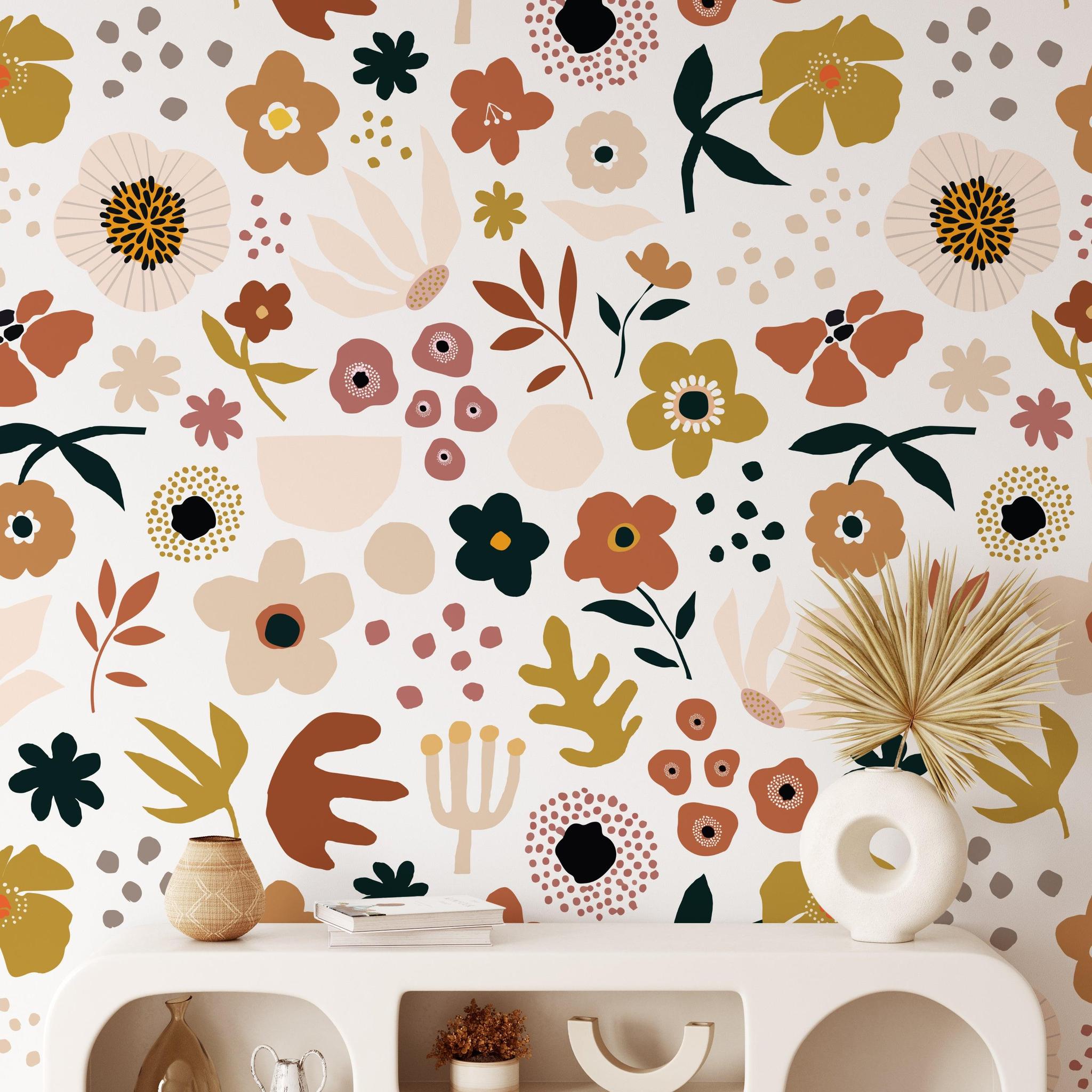 Mila Wallpaper by The Stefanie Bloom Line enhancing a modern living room's decor with vibrant floral patterns.