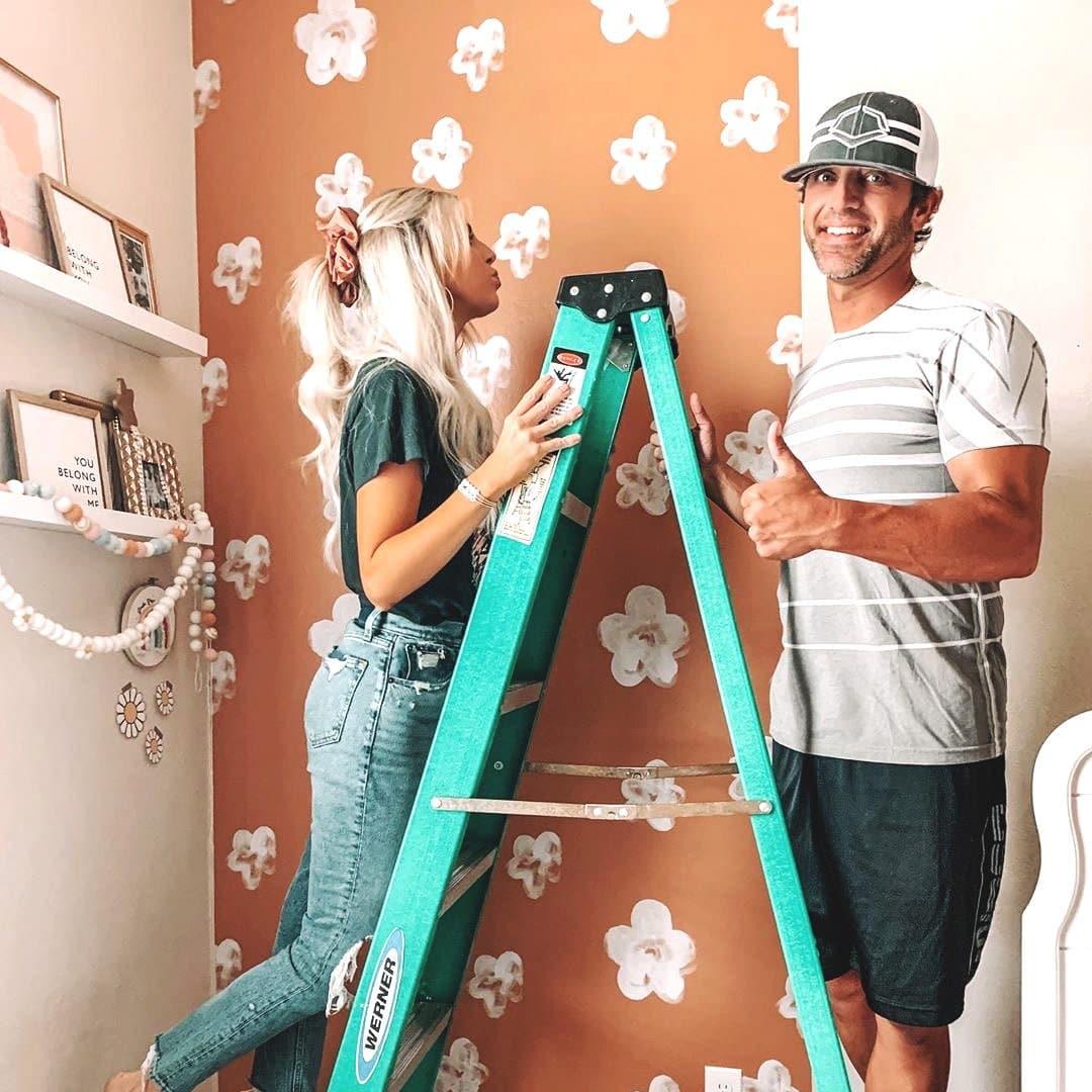 Peachy Perfect Wallpaper by The Minty Line in a cozy room, with focus on elegant wall design.